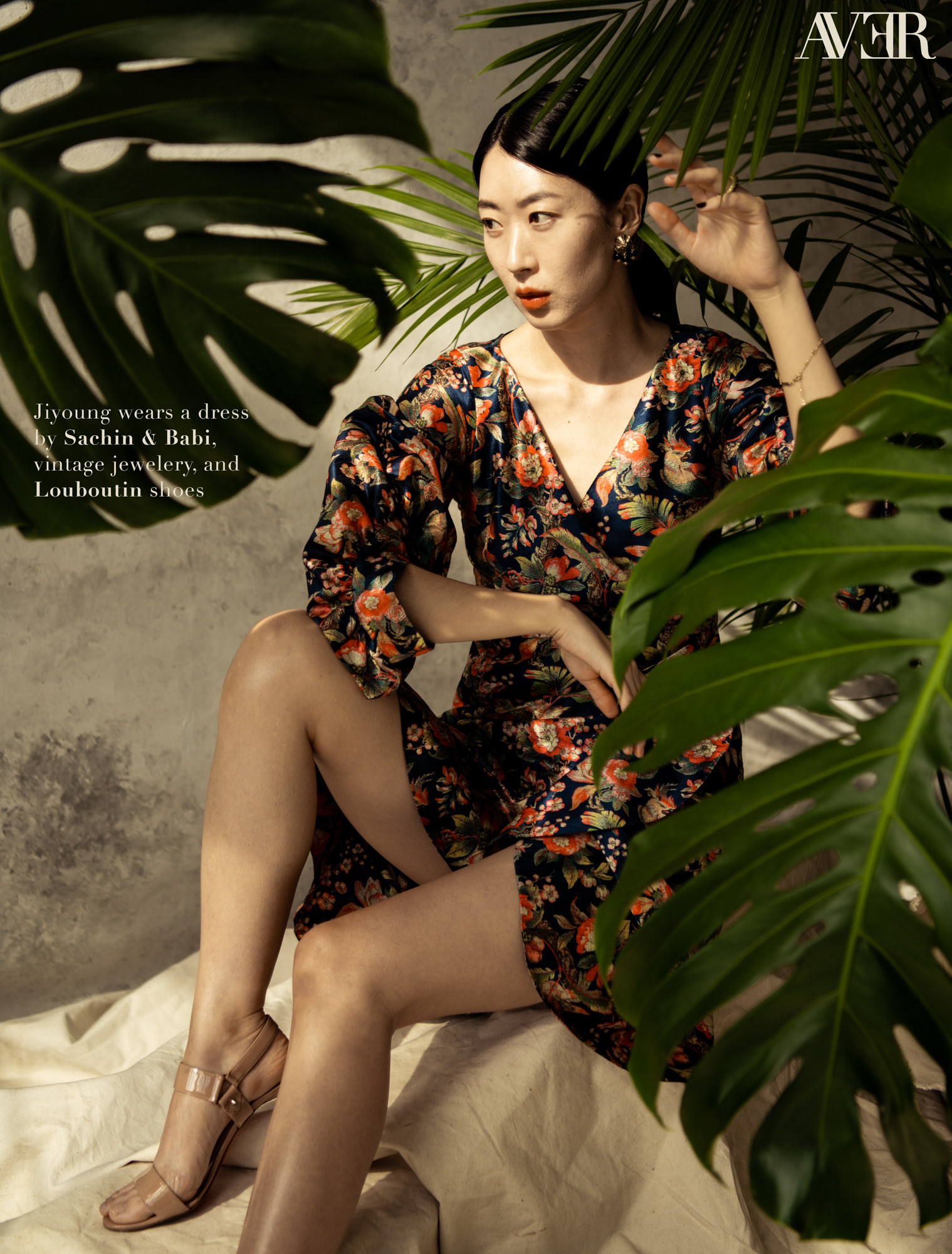 Jiyoung Chang of Fenton Models sits with palm leaves