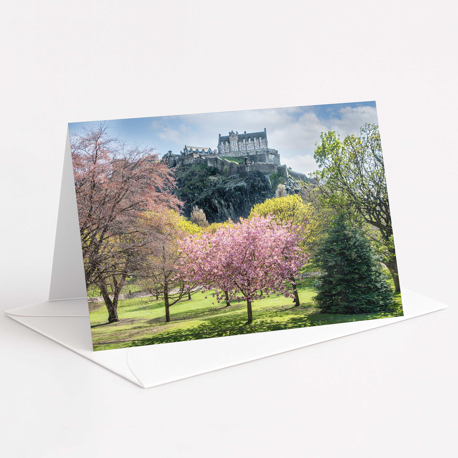 An image of a card showing Edinburgh Castle with trees in the foreground. 