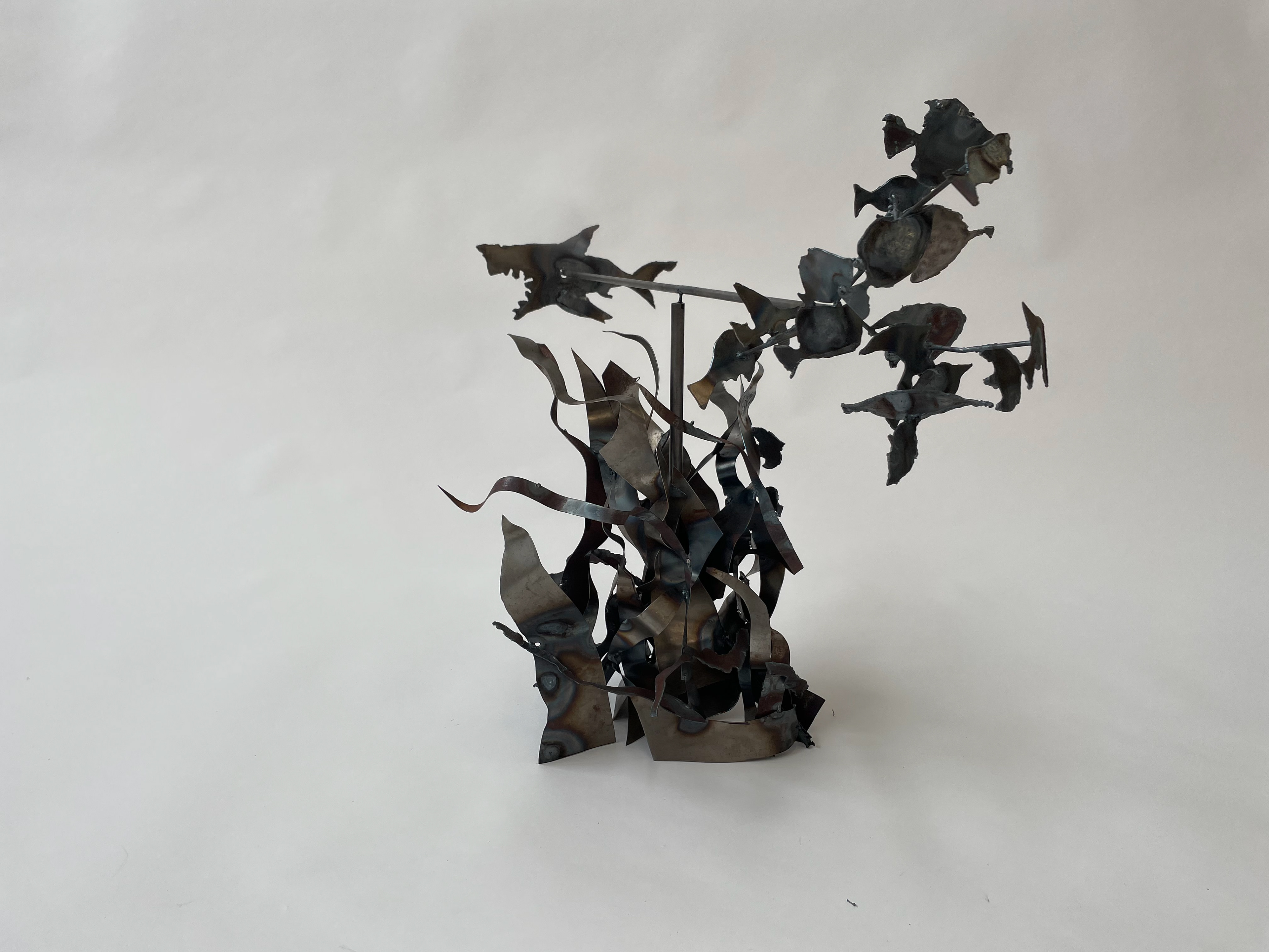 Spinning shark and fish sculpture. Welded with aluminum.