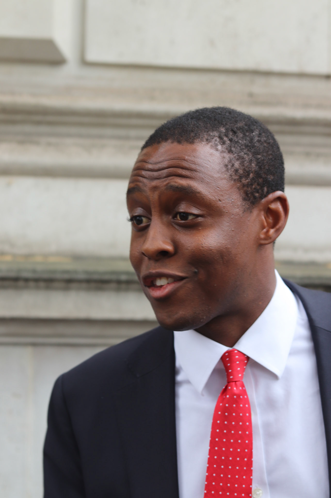 Bim Afolami MP speaks to a constituent outside Downing Street
