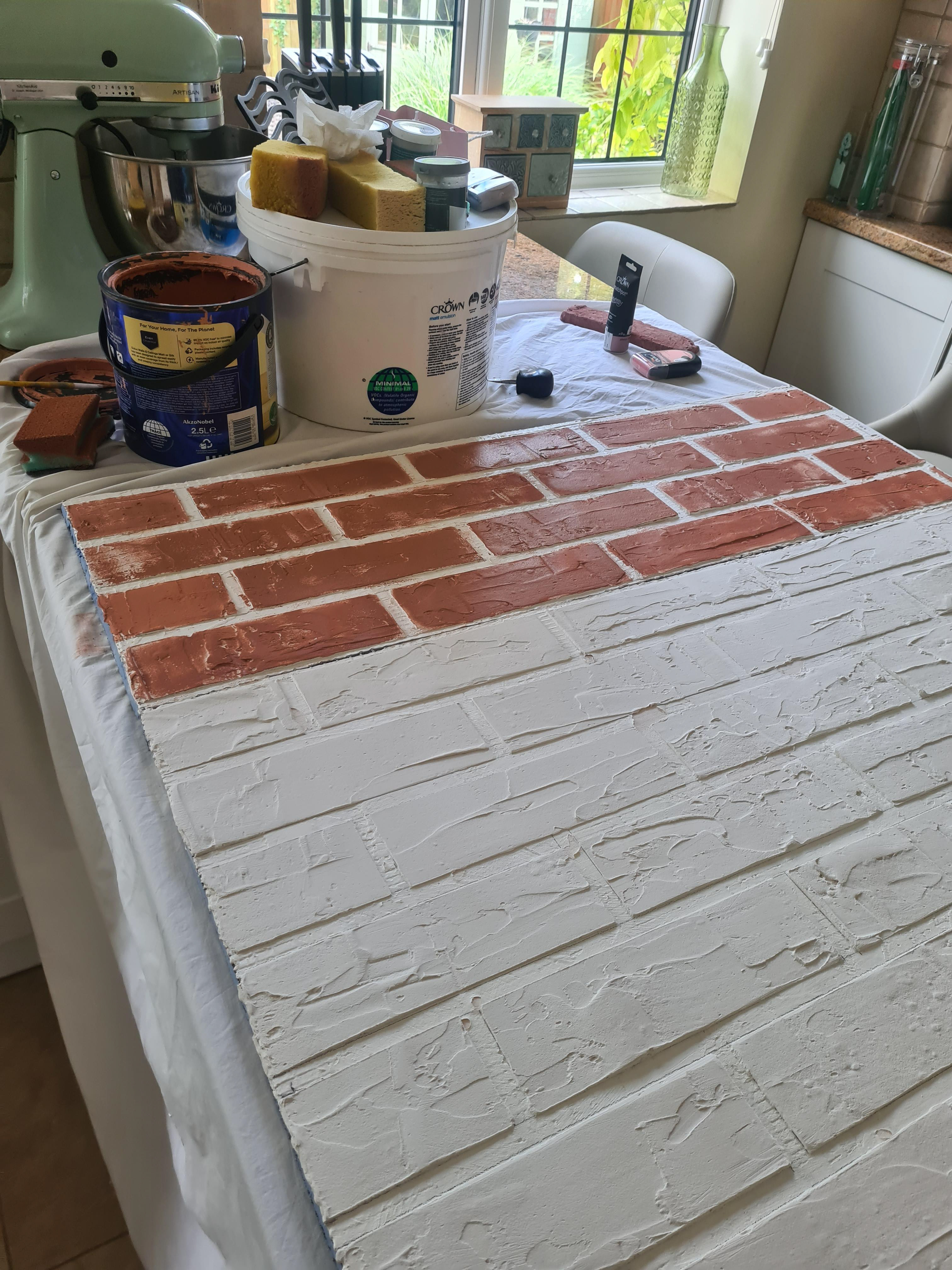 Sponging on a base terracotta colour for the bricks 