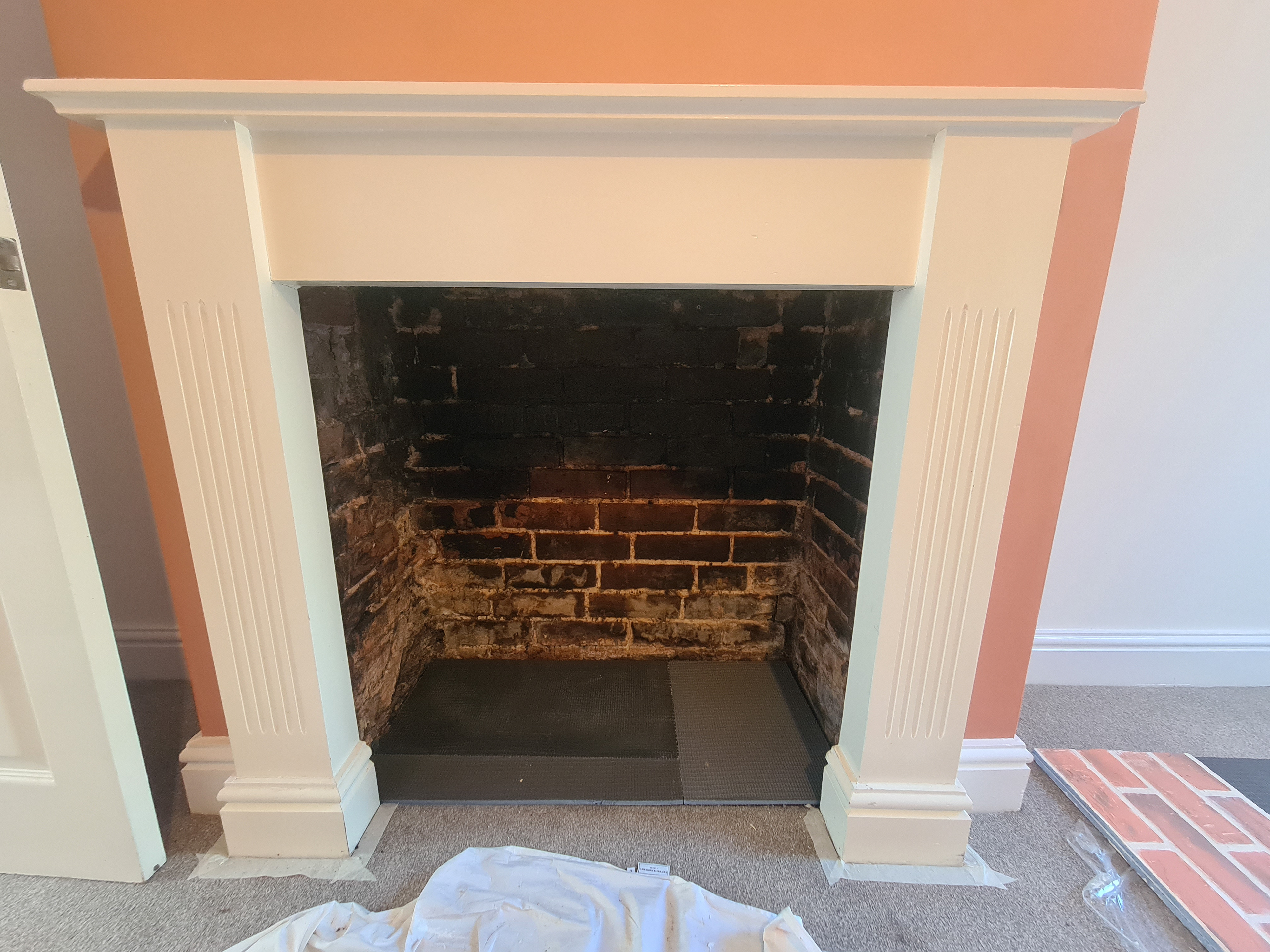 The old burnt and crumbling fireplace