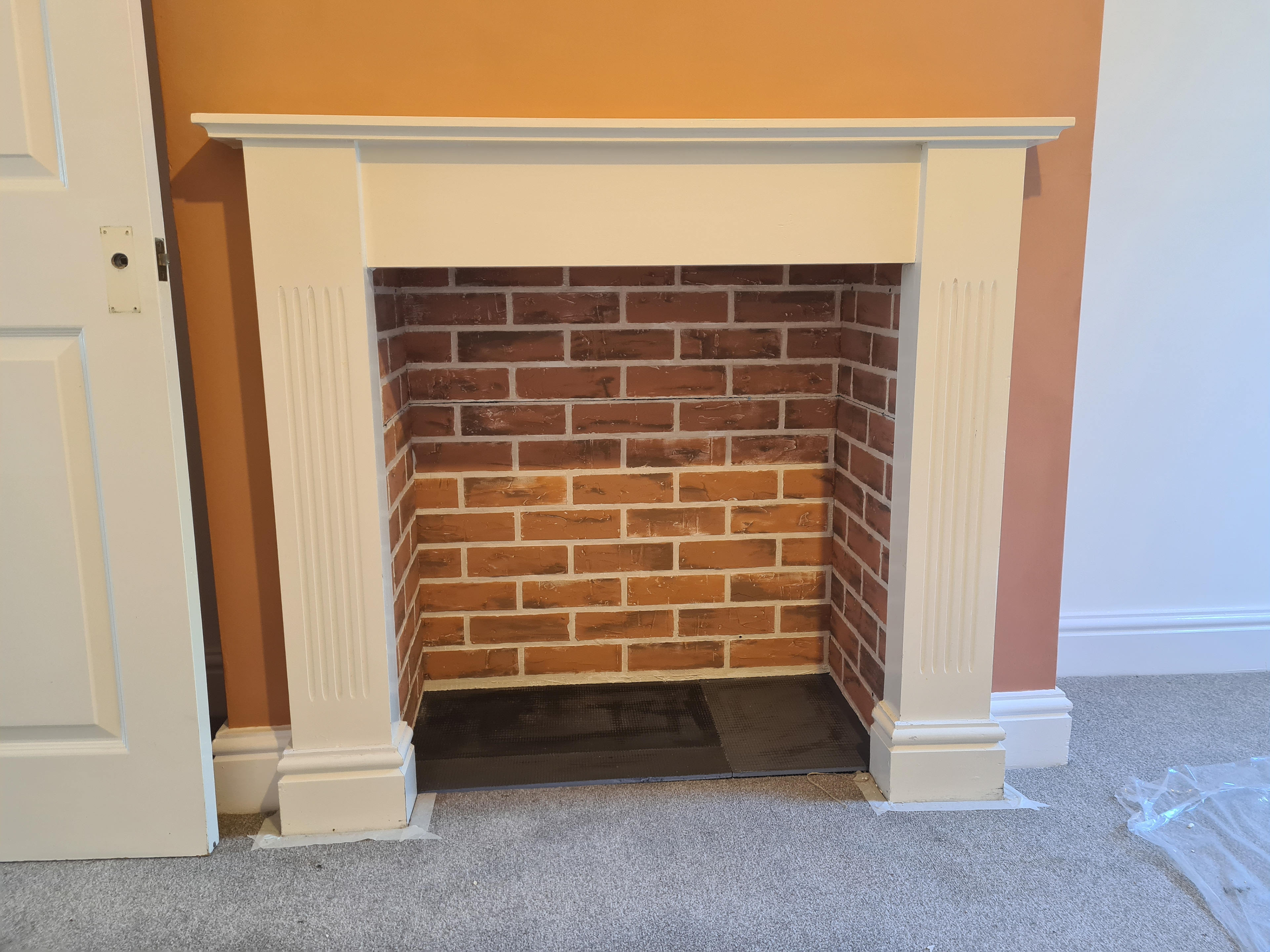 Fitting the faux wall into the fireplace