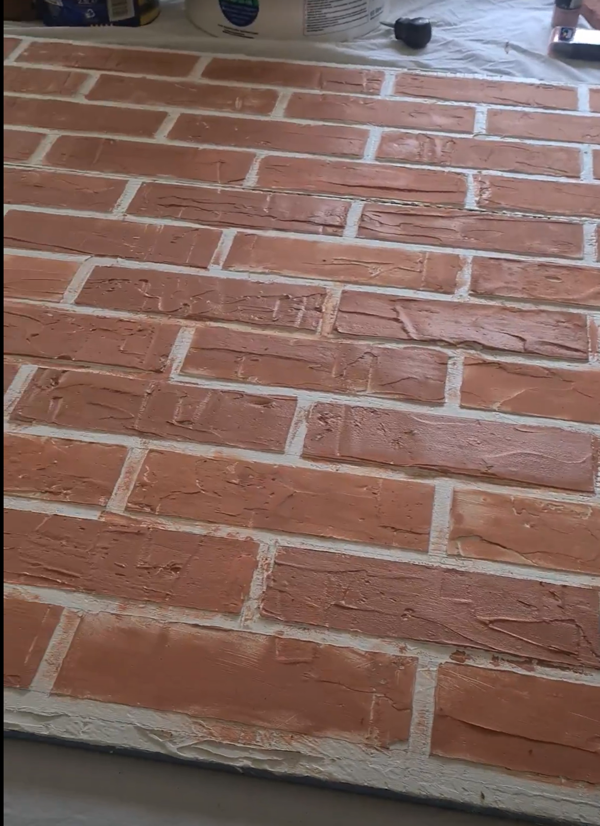Adding variation in the bricks by changing the pressure of the sponge