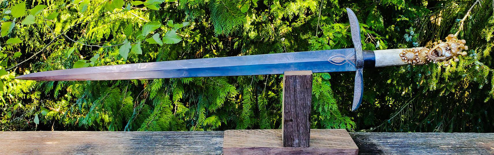 Covid-19 Demon Sword. 5160 blade with engracing, grip is carved antler with a blackwood spacer and a fileworked and textured guard