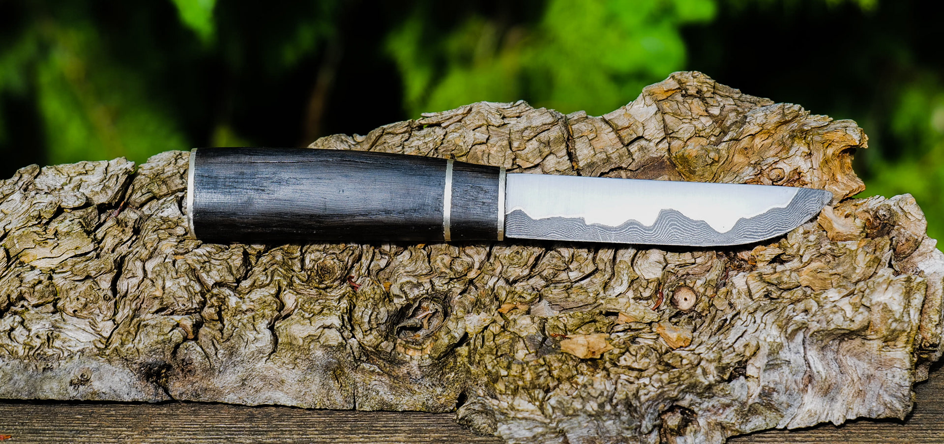Puukko, patternwelded core with stainless cladding (san mai), sterling silver bolster, spacer and buttplate with 5000 year old bog oak