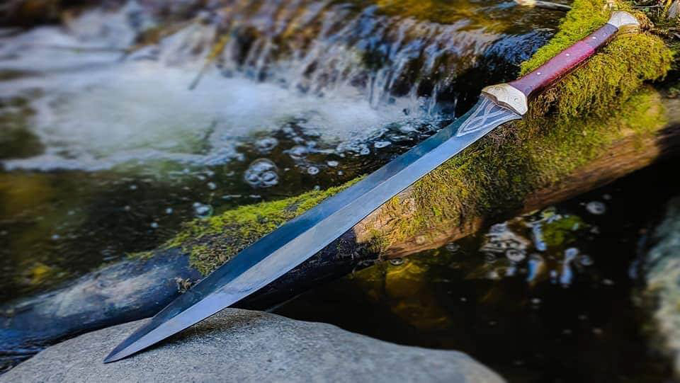 Two handed tactical Gladius, engraved blade, bronze guard and pommel engraved, vine file work around the handle, box elder and oak burl handle.
