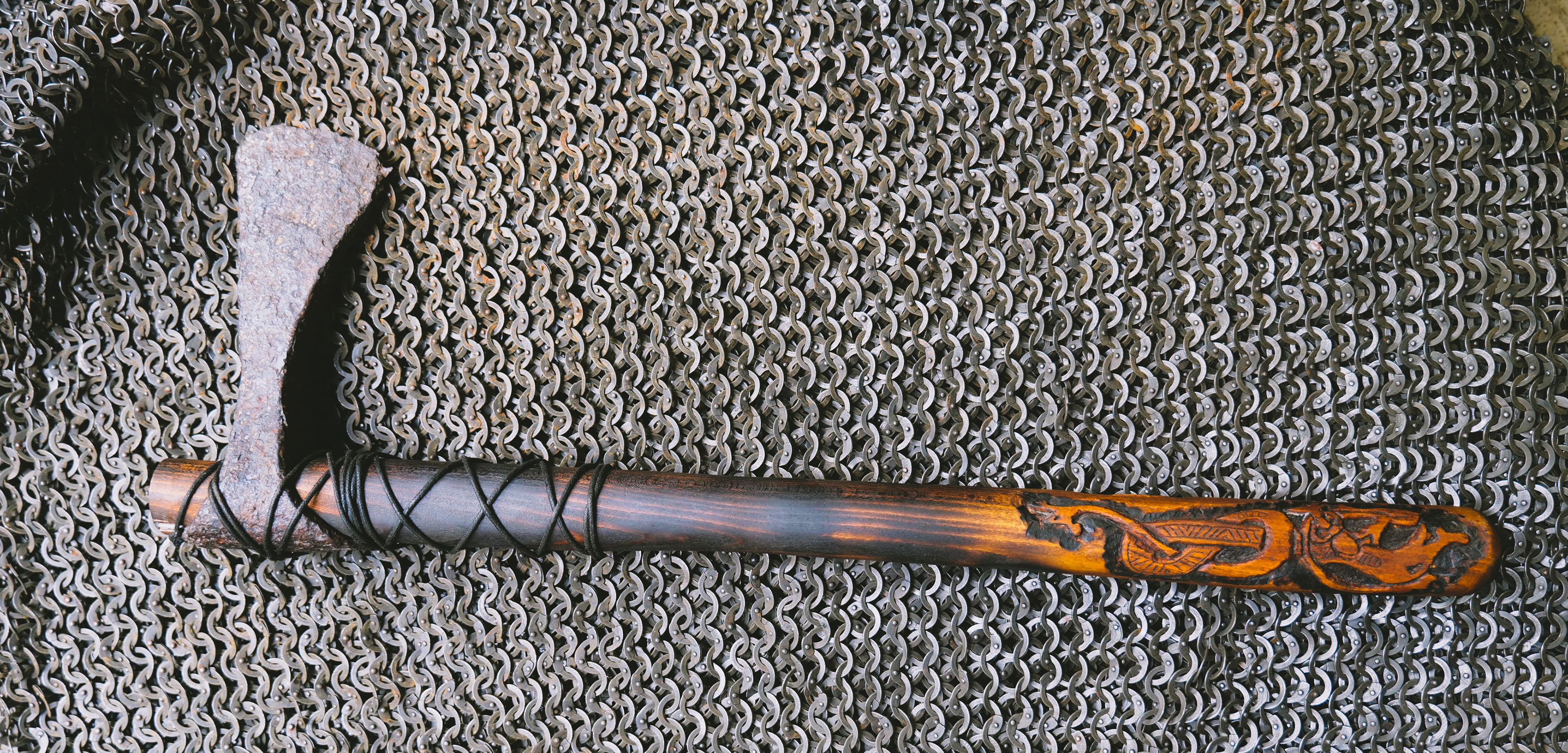 11th century axe head mounted on a carved haft