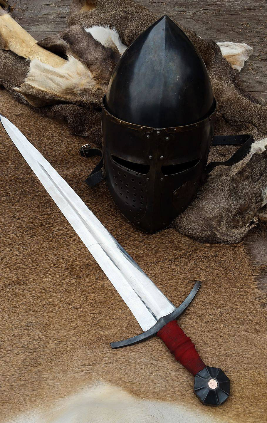 XIV arming sword. 1095 carbon steel, insert is hammered float copper. Inspired by a surviving sword from the 14th century.