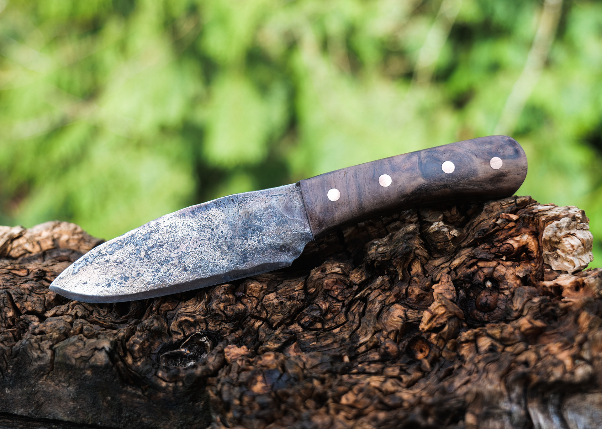 Grade A. Forged to shape and heat treated by Chris. Grip is claro walnut with copper pins