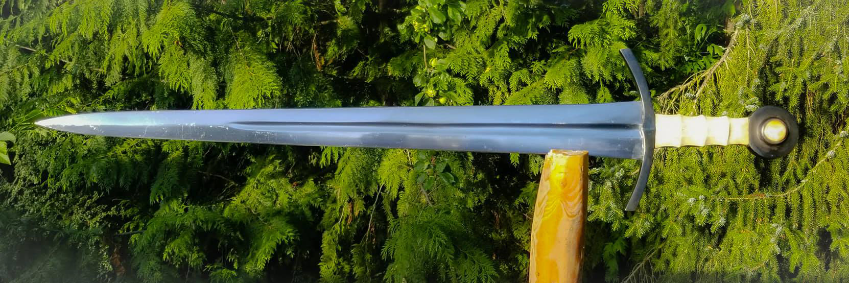 A gladius style handle for a type xiv. The handle is carved moose antler, pommel inserts are walrus ivory. Guard and pommel were chemically blued.