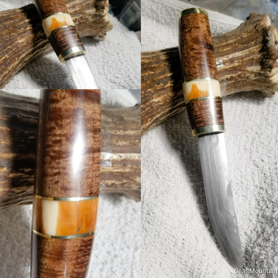 Low layer pattern weld, grip is tasmanian blackwood, with walrus ivory and brass. OAL 8" Blade: 4.25"