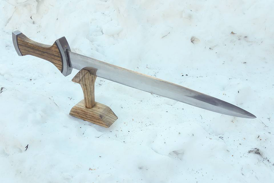 swiss degen. I've lost some of my specs on this. but 5160 blade with wrought iron guard and pommel with brass pins, zebrawood handle.