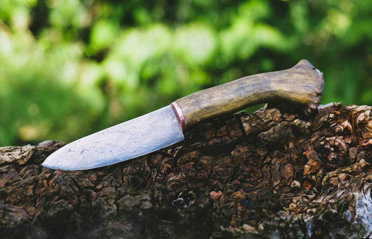 Grade AA. Forged to shape and heat treated by Chris. Grip is caribou antler with a copper bolster