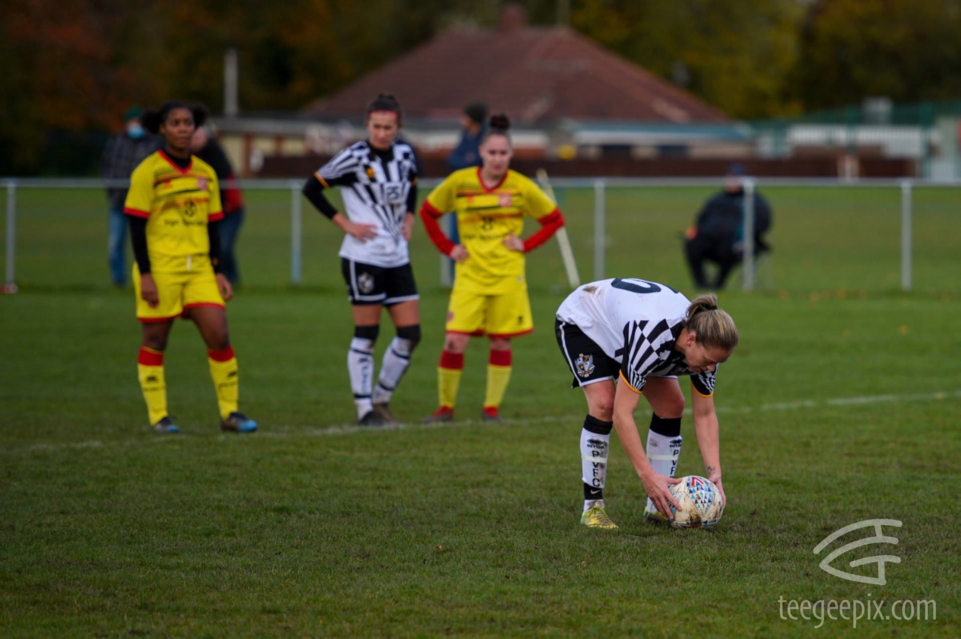 Kim Cartlidge spots the ball for her second penalty take of the match