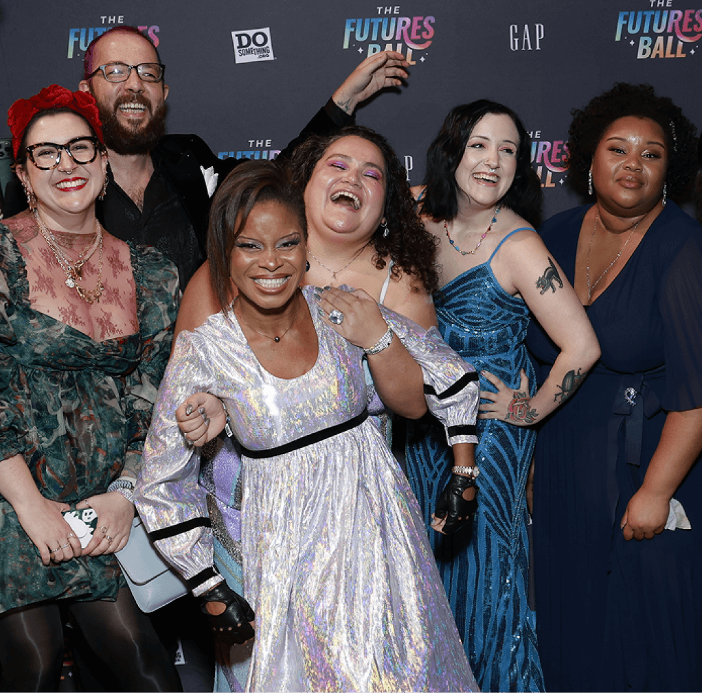 DoSomething.org team poses on the red carpet in front of a branded step-and-repeat at The Futures Ball gala, celebrating youth activism and creative production.