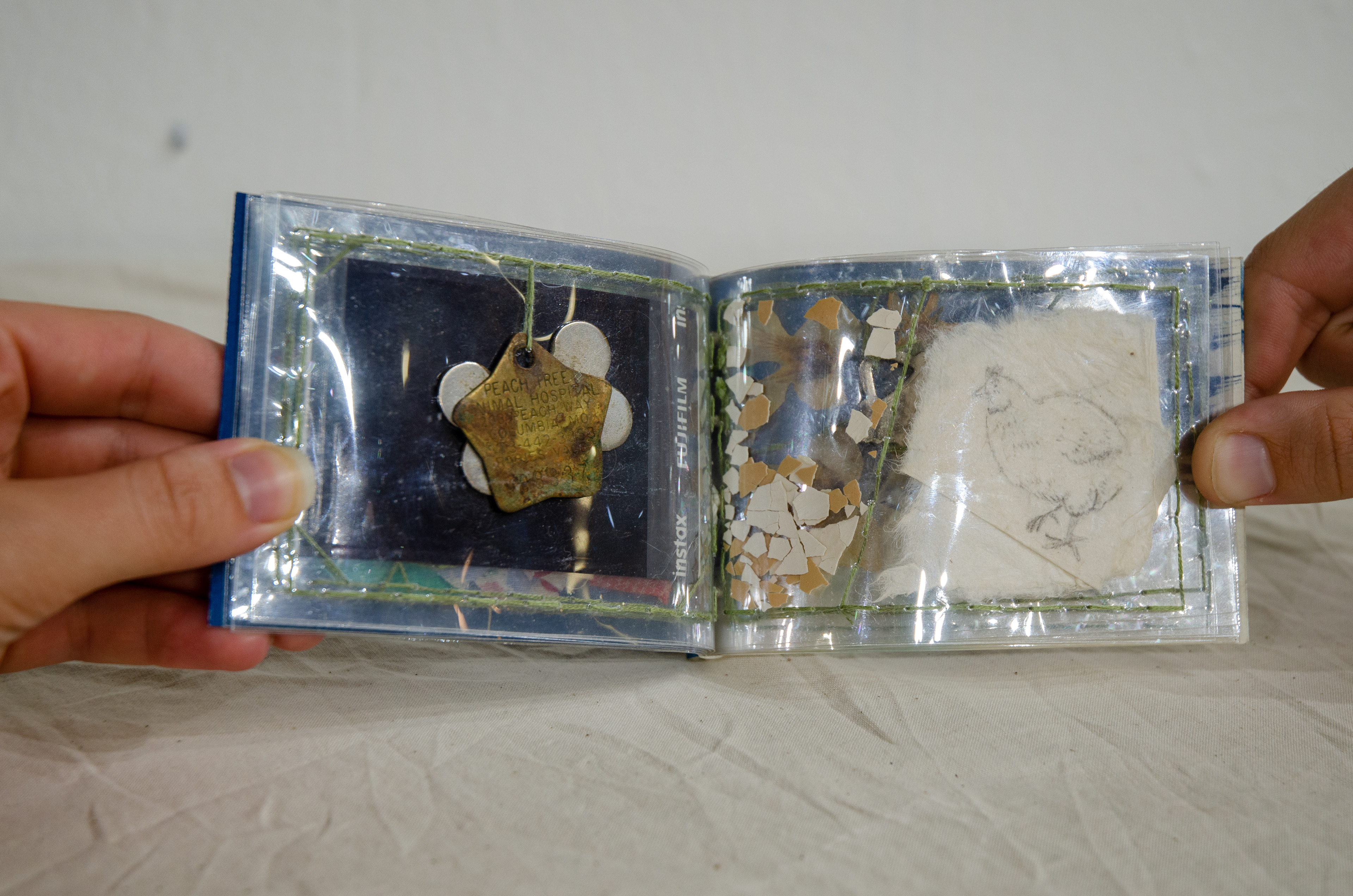 'Pack Rat,' 2020. Cyanotype on paper, found objects, Duralar. 