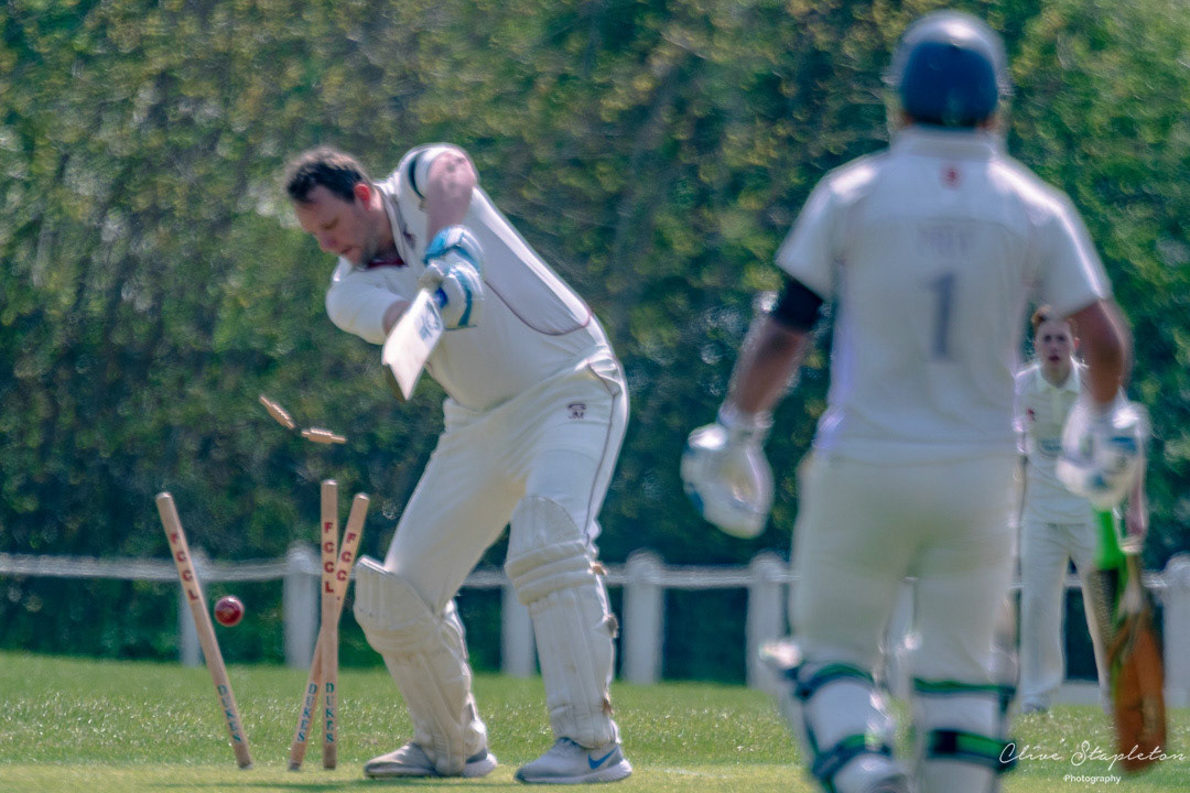John Mulholland of New Bradwell is bowled by Sam Chapman of Newport Pagnell.
