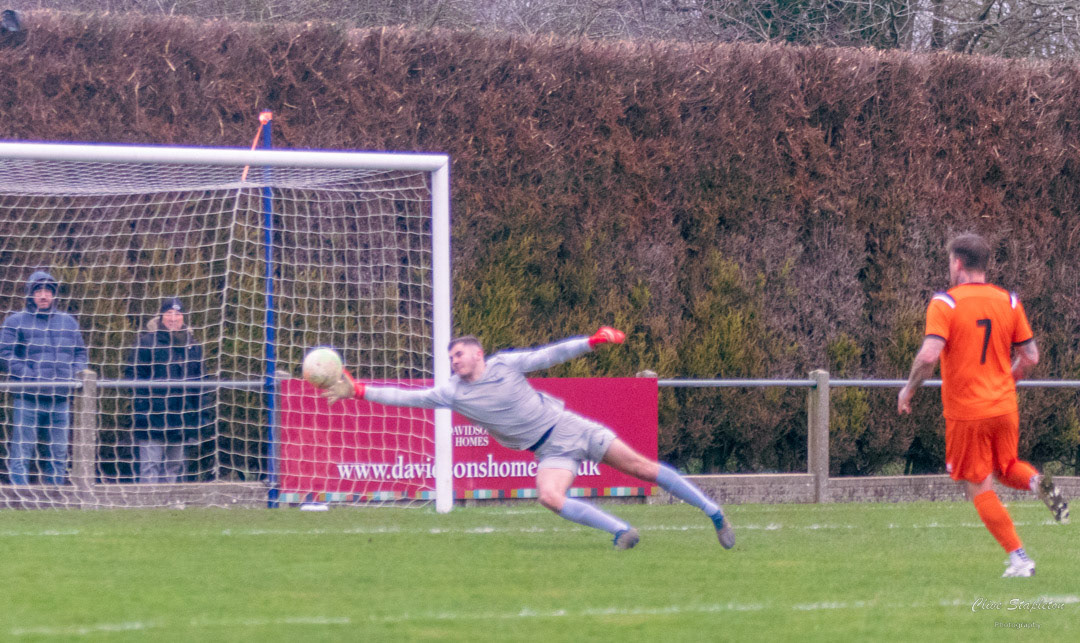Gary King of Skegness Town AFC beats Aiden Jeynes of Heather St Johns FC makes it 3 for Skegness Town AFC.