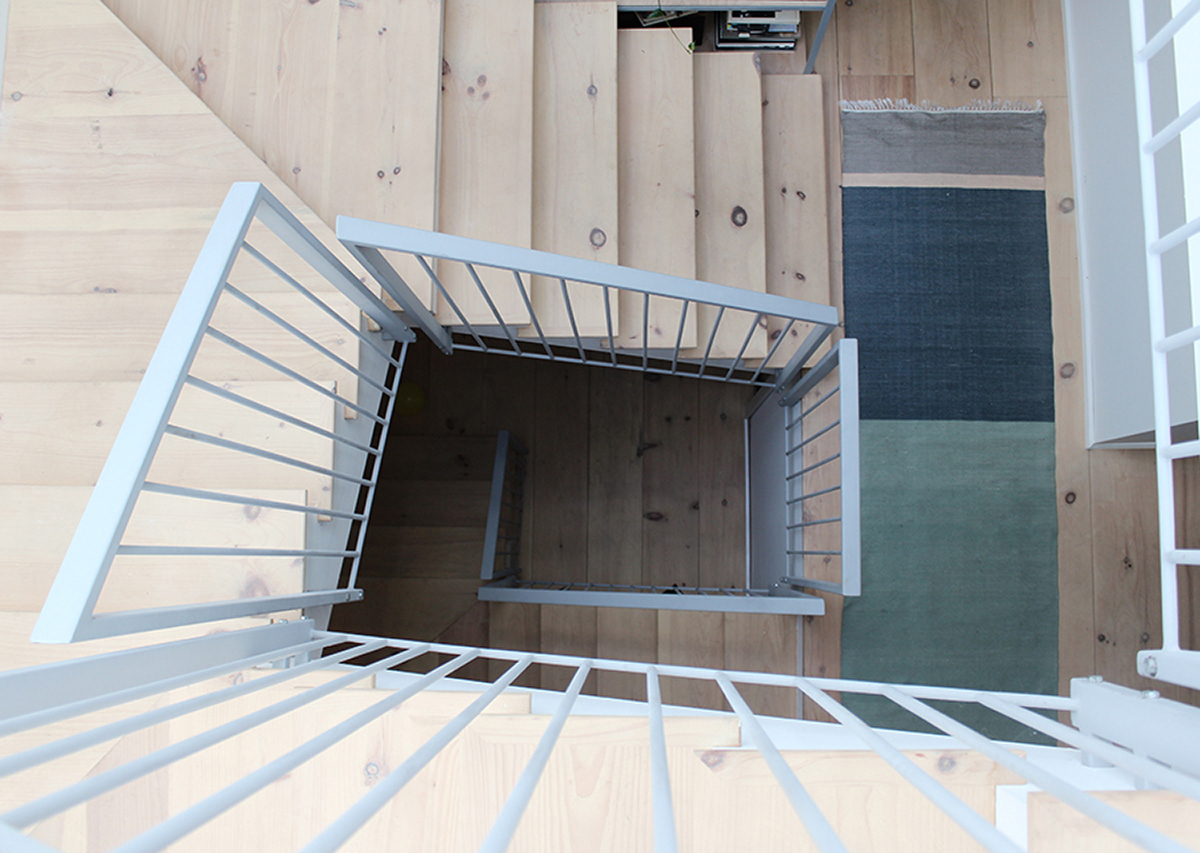 View down through stair at Lewis Vinz residential renovation in Chicago