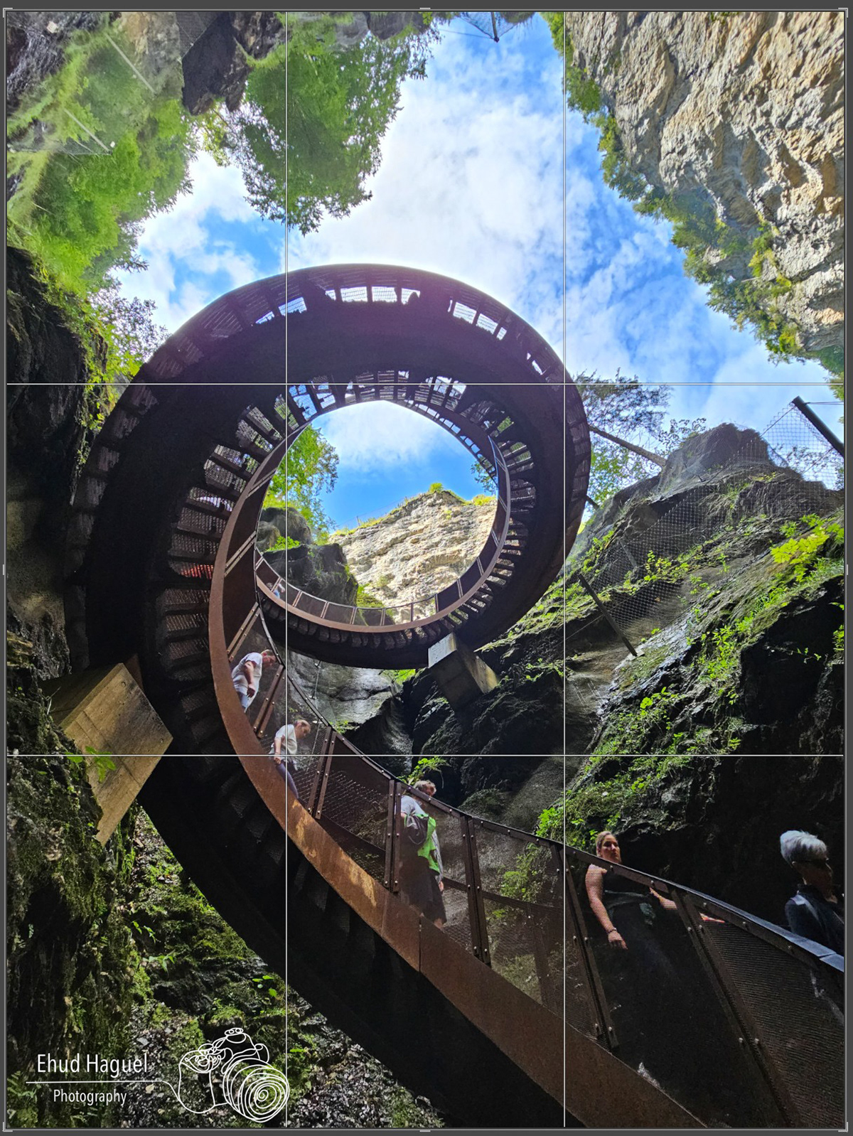 Spiral staircase viewed from below in rocky gorge, composition photography Austria