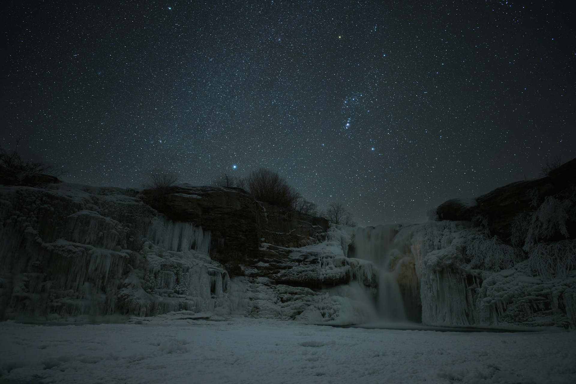 Starry winter night over Lundbreck Falls, Lundbreck, Alberta.