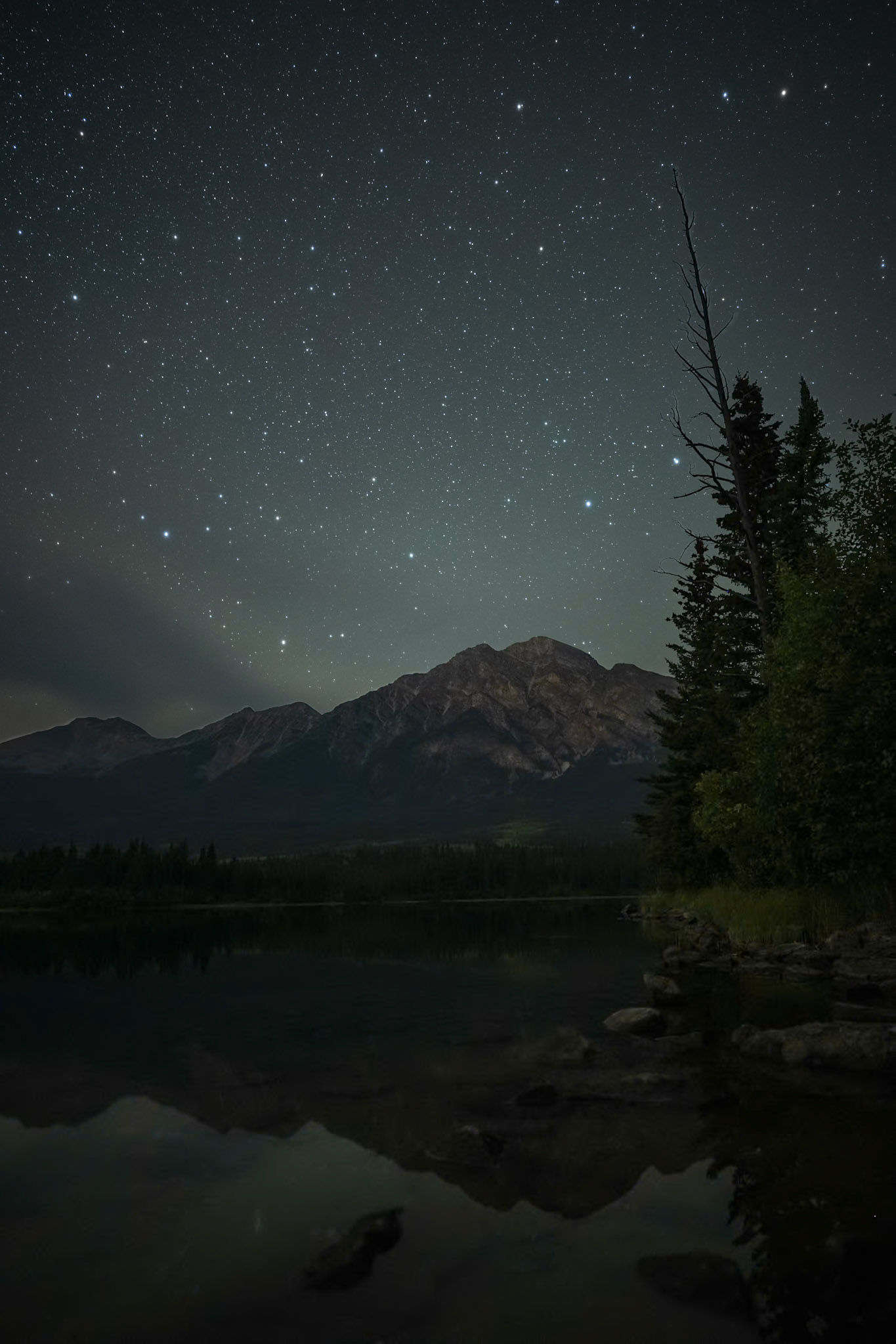 Stars over Pyramid Lake in Jasper National Park, Alberta.