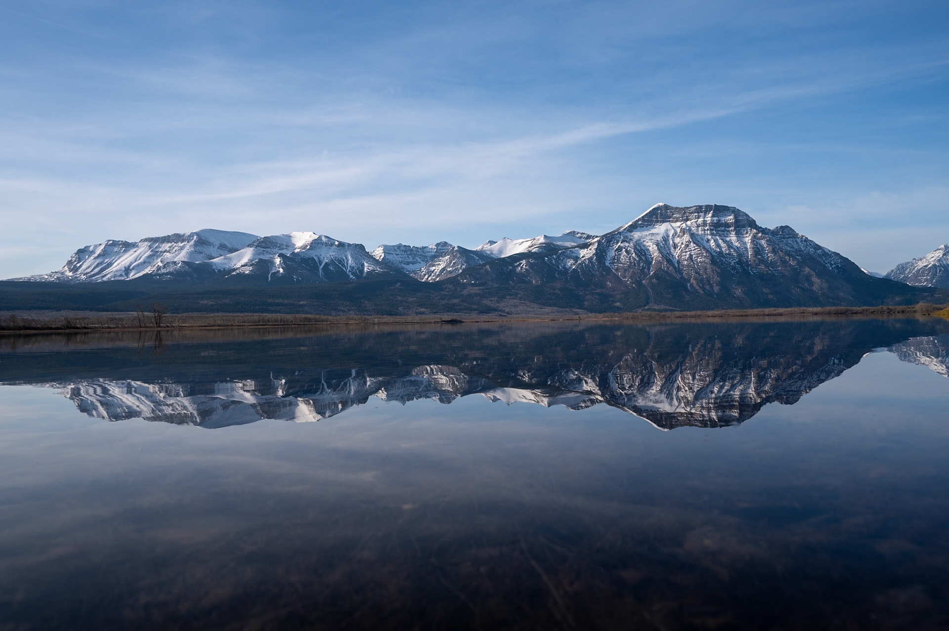 Morning reflection in Lower Waterton Lake, Waterton Lakes National Park, Alberta.