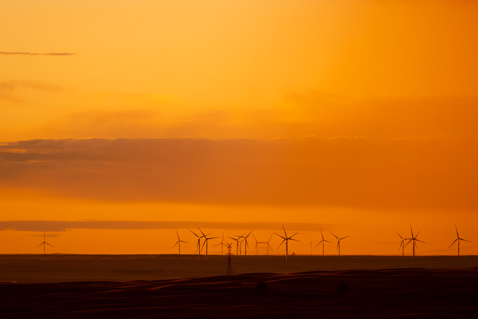 Sunset over the prairies and wind turbines of southern Alberta.