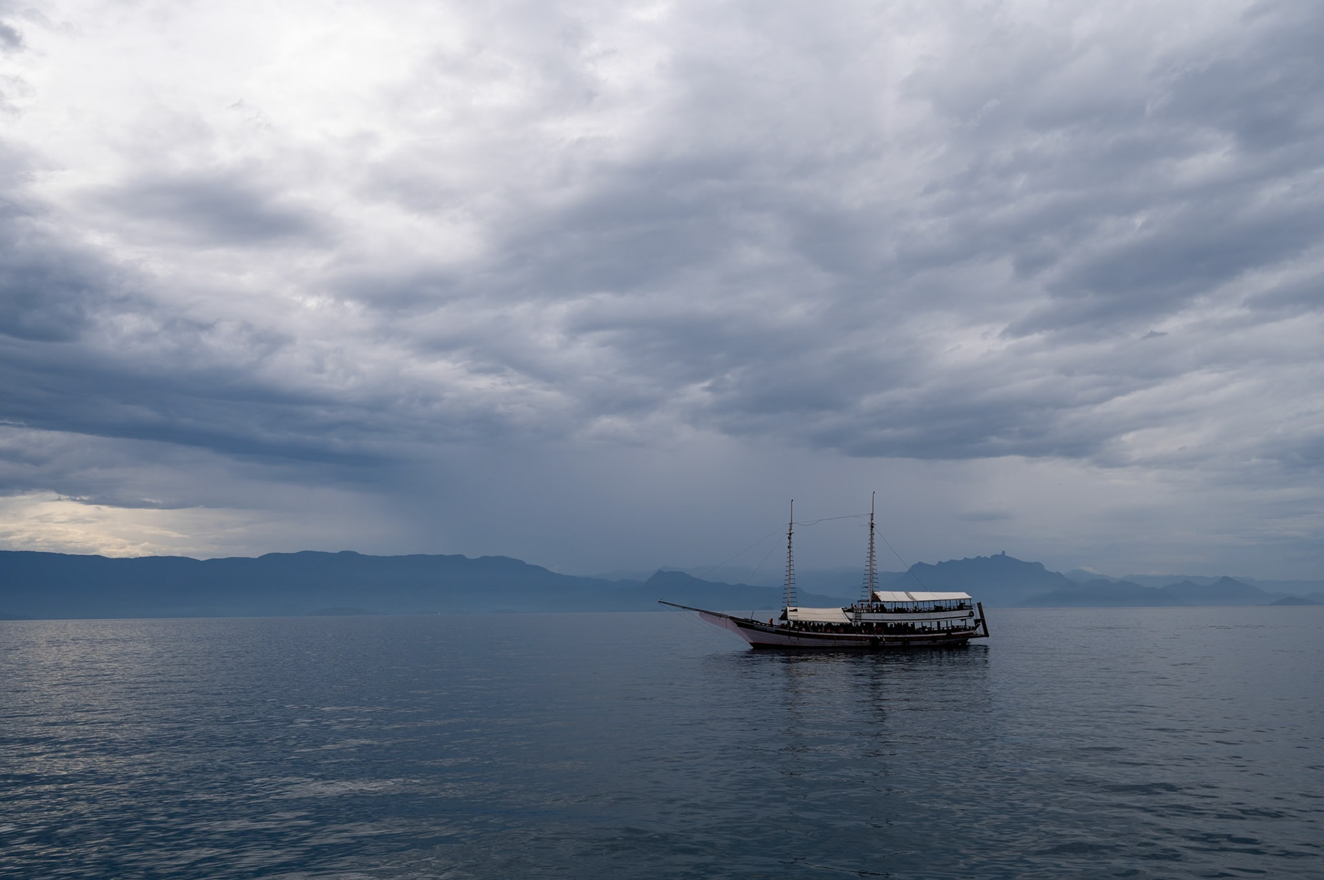 Tour boat in Atlantic ocean off coast of Paraty, Brazil.