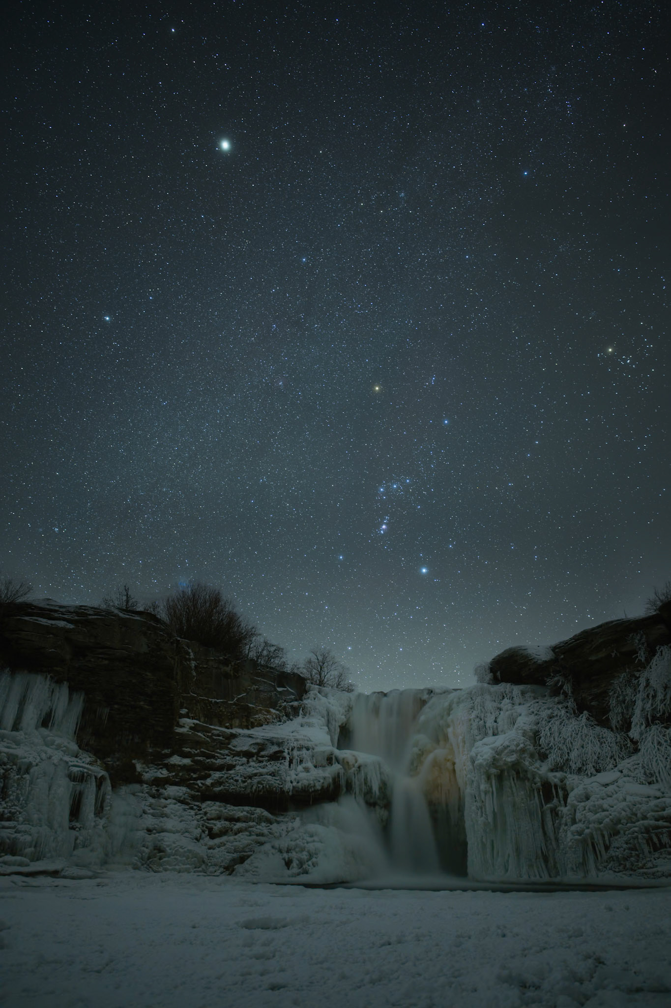 Starry winter night over Lundbreck Falls, Lundbreck, Alberta.