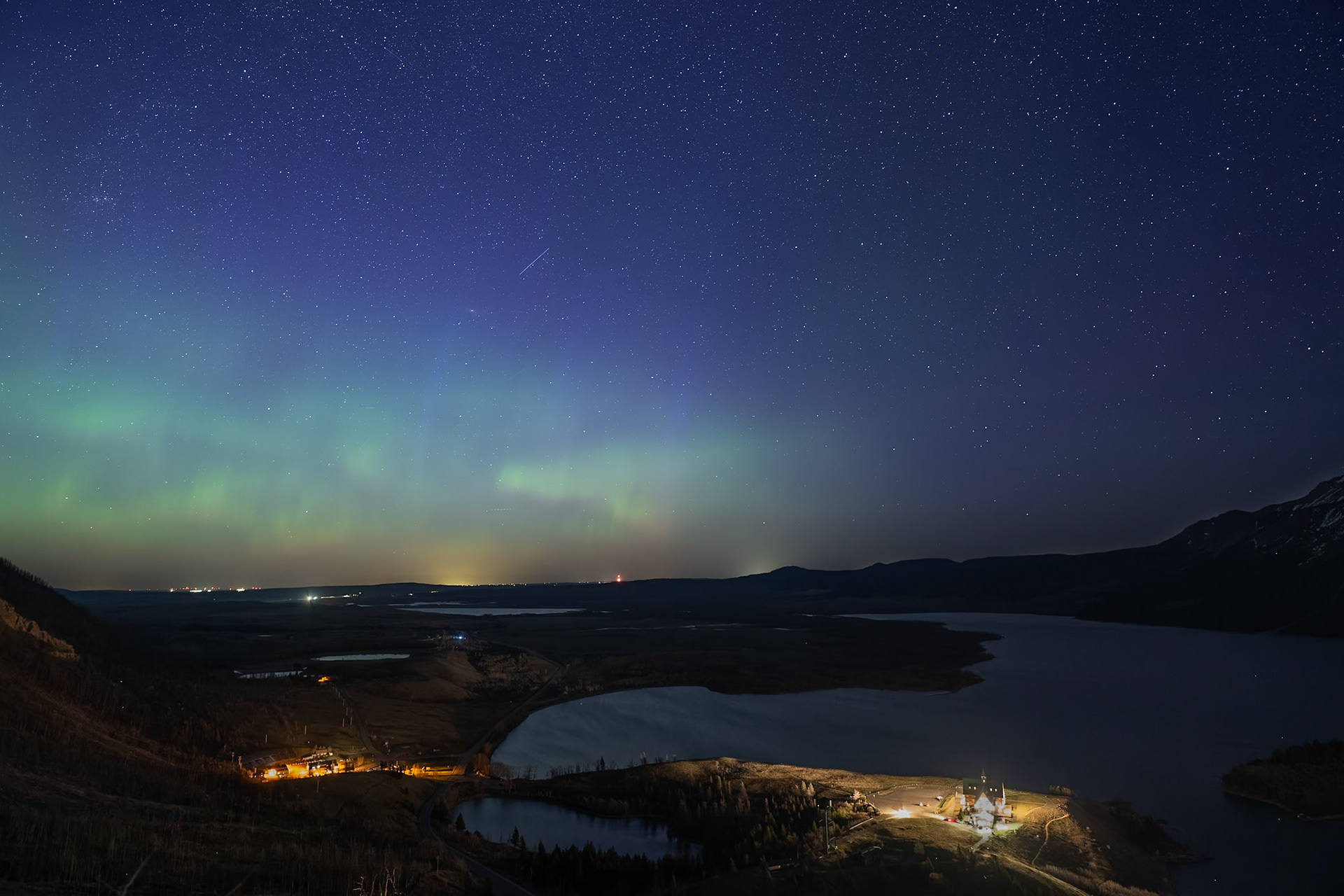 Looking north from Bear’s Hump, the Prince of Wales Hotel with faint northern lights, Waterton Lakes National Park, Alberta.