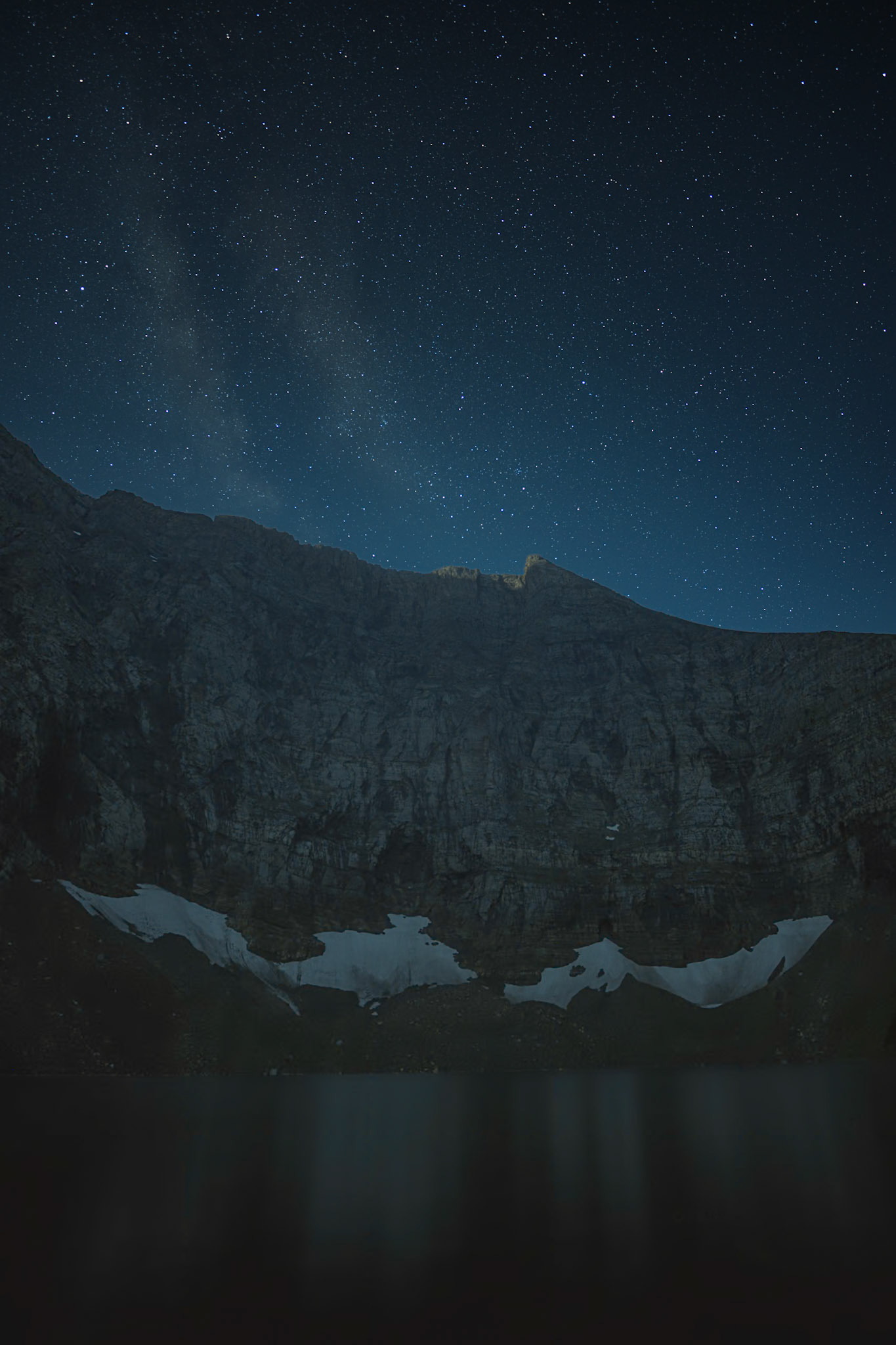 Faint milky way over Alderson Lake in Waterton National Park.