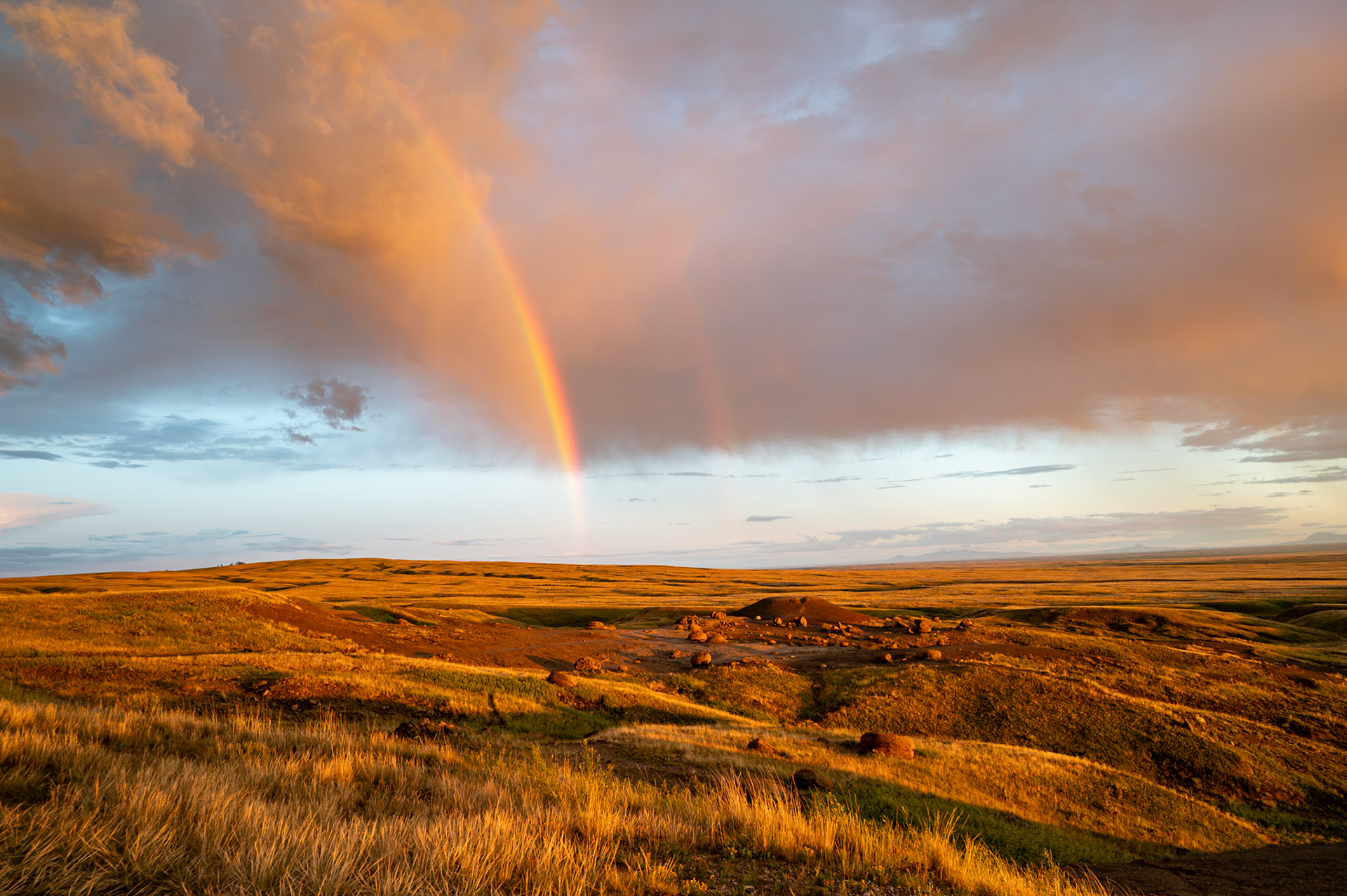 Rainbows over Rock Coulee Natural Area in southern Alberta
