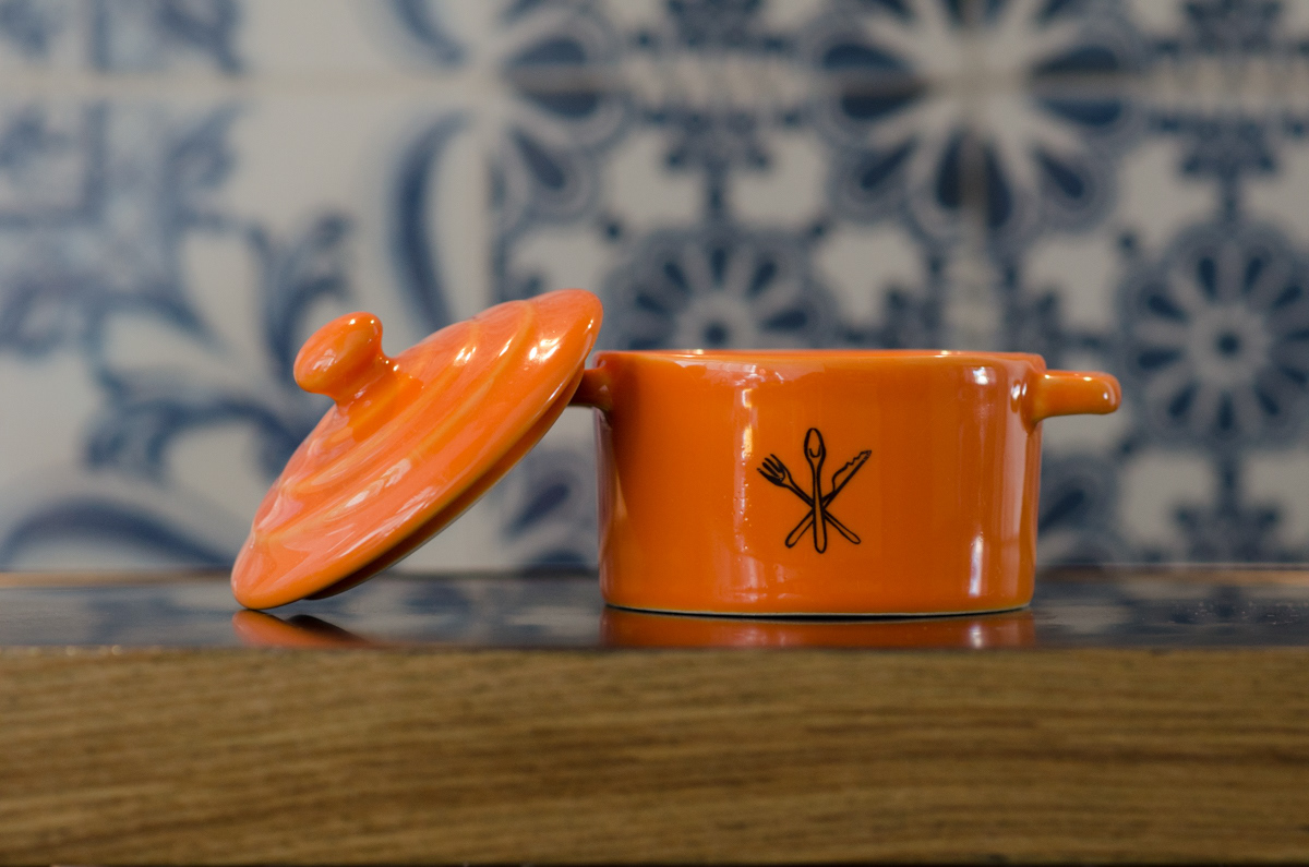 Customized orange mini casserole with a flatware illustration on the front.