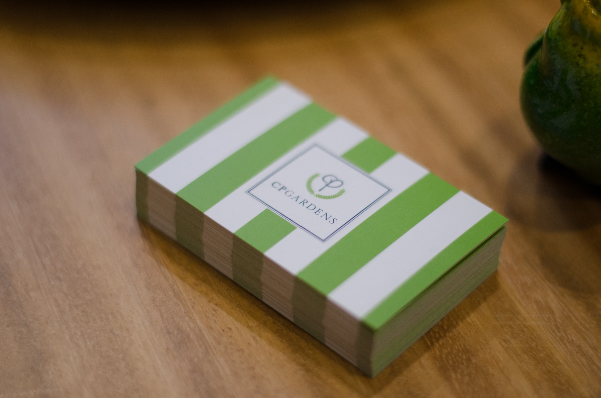A CP Gardens' business card pile.