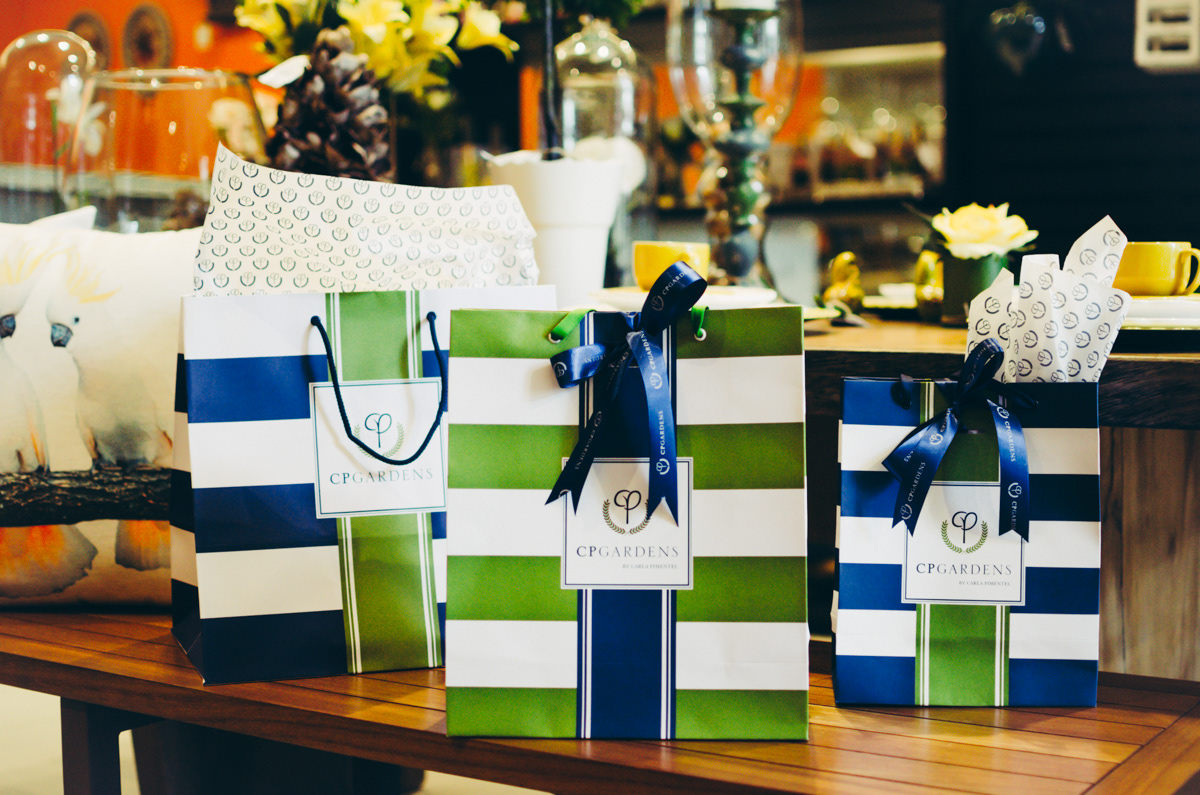 CP Gardens' shopping bags with custom ribbons and tissue paper.