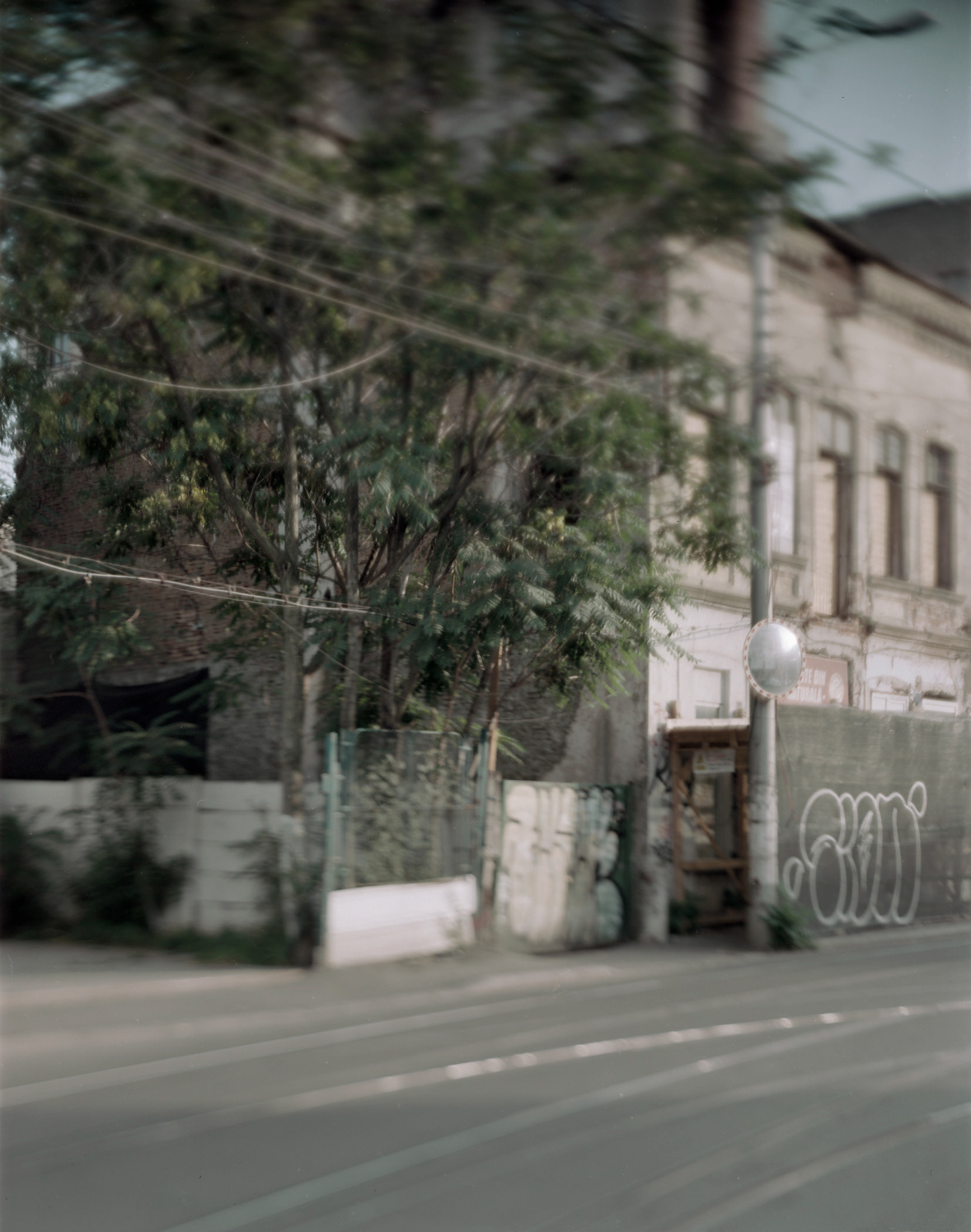 Bucharest, Romania, 2018 / In the city's erstwhile Jewish district––behind the gate at left is the oldest synagogue still standing, in a state of dilapidation.