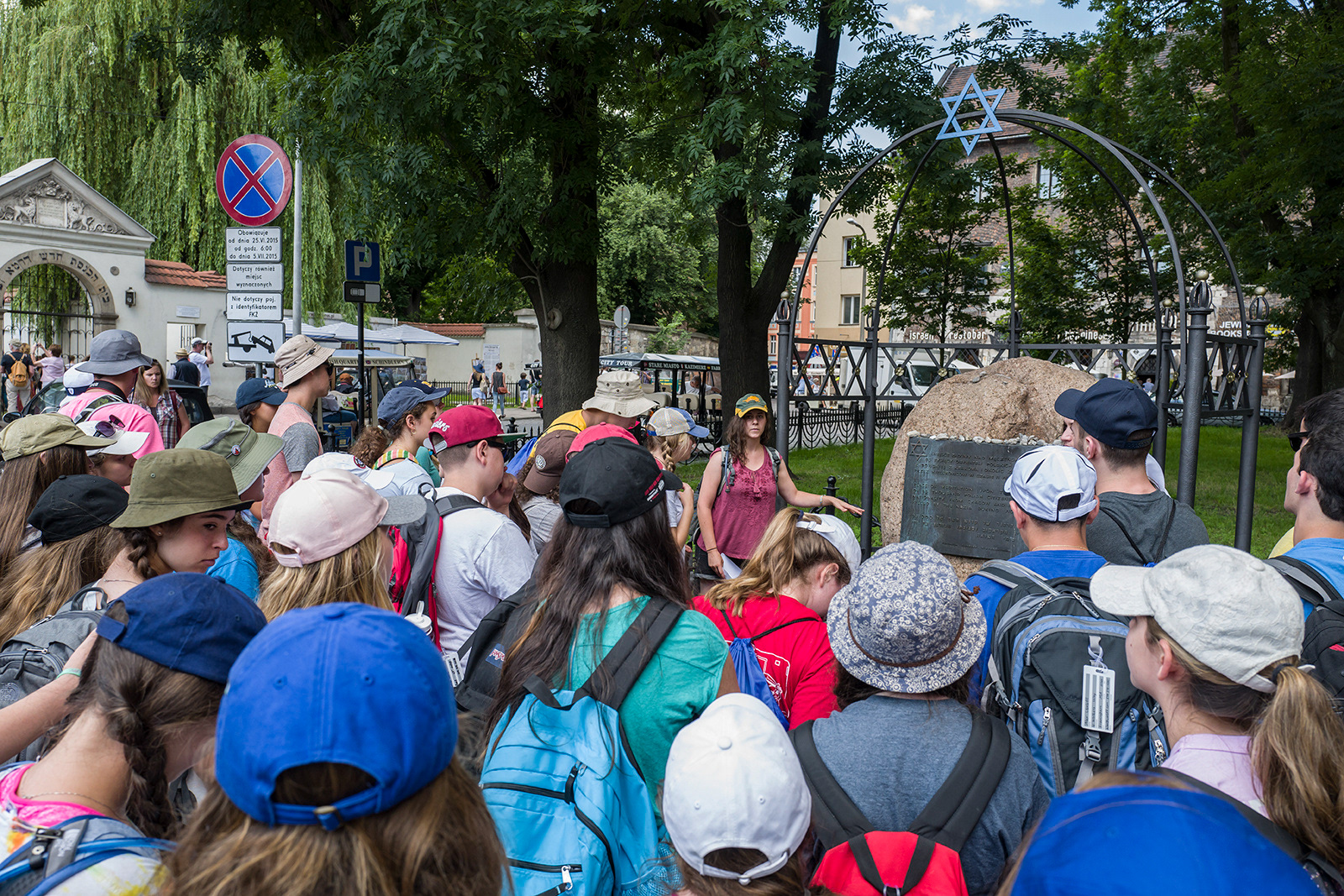Visitors studying Jewish history in the streets of Kazimierz, Kraków