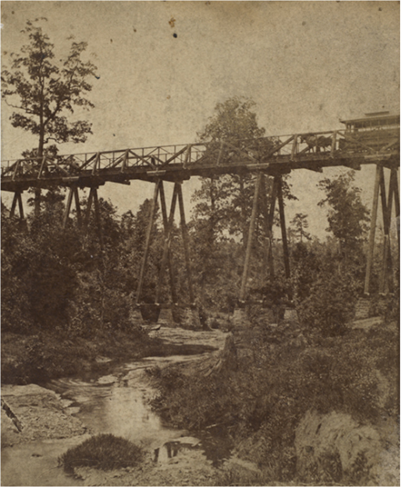 "Intersection of Clear Creek and the Dummy Line of Atlanta Street Railroad Company, ca 1874. It's now where Ponce De Leon Ave meets Penn Ave" (Atlanta History Center). Source: http://album.atlantahistorycenter.com/cdm/singleitem/collection/athpc/id/419/rec/1