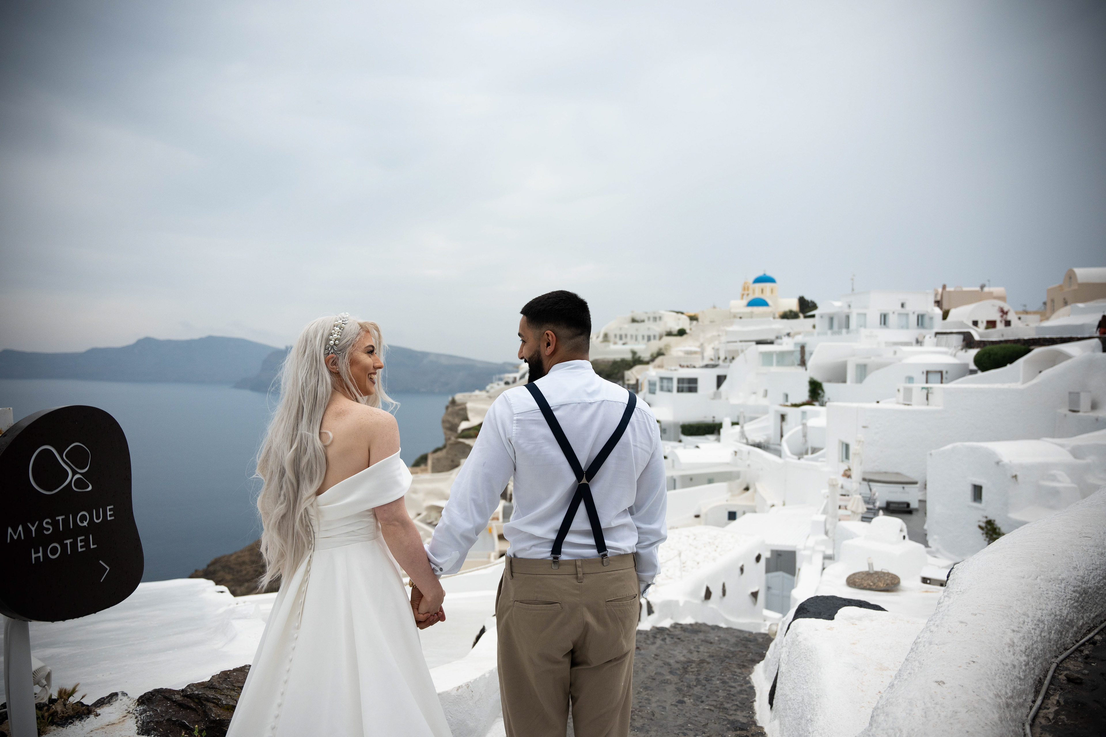 Cinematic shot of a couple in Santorini Greece.