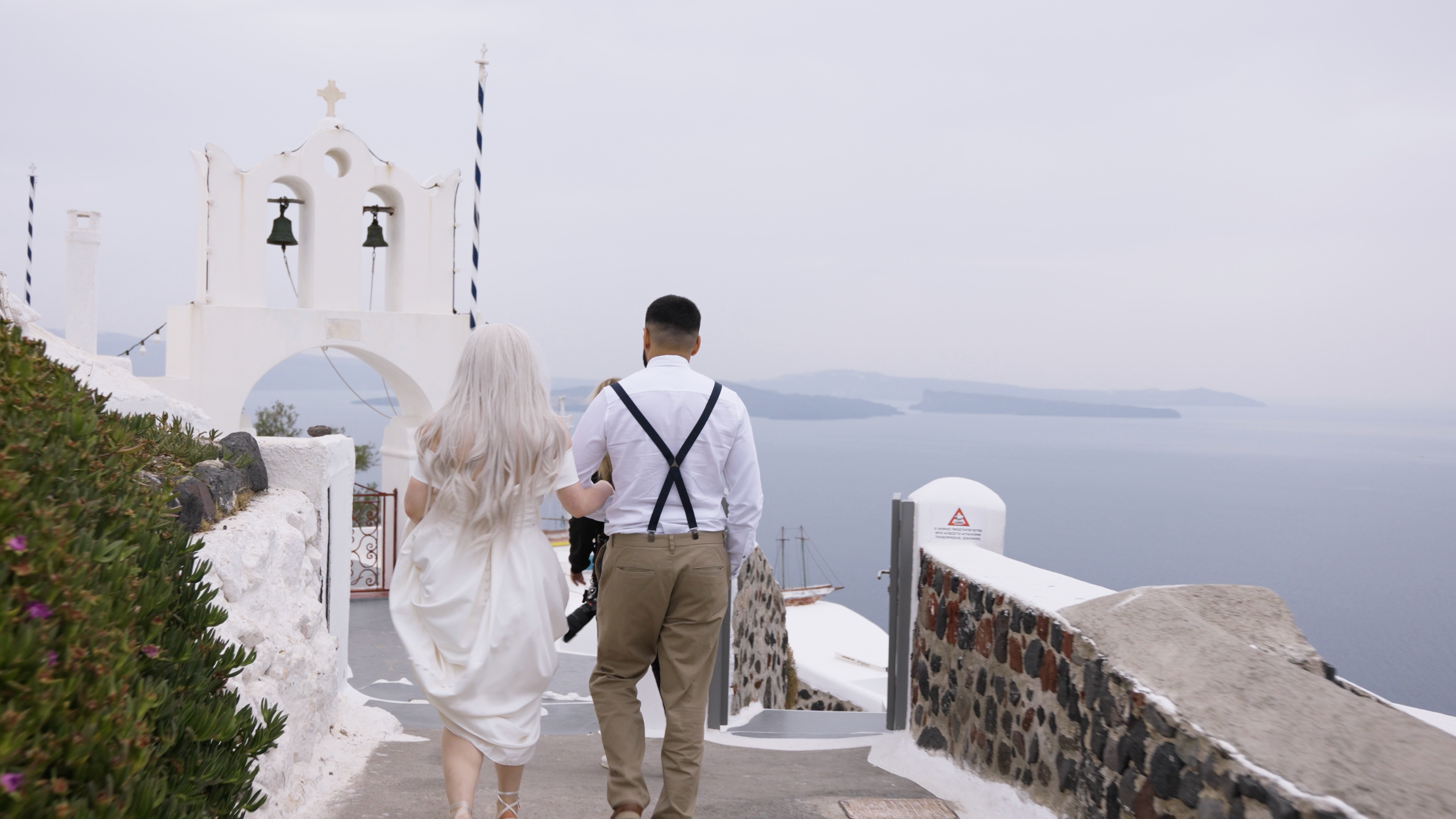 Cinematic shot of a couple in Santorini Greece