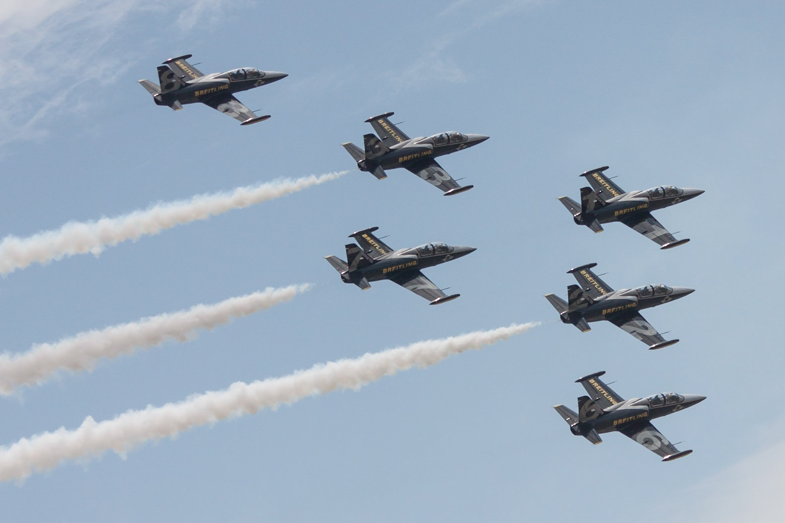 Aero L-39C Albatroses of the Breitling Jet Team perform at the Quonset ANGB in May 2015.