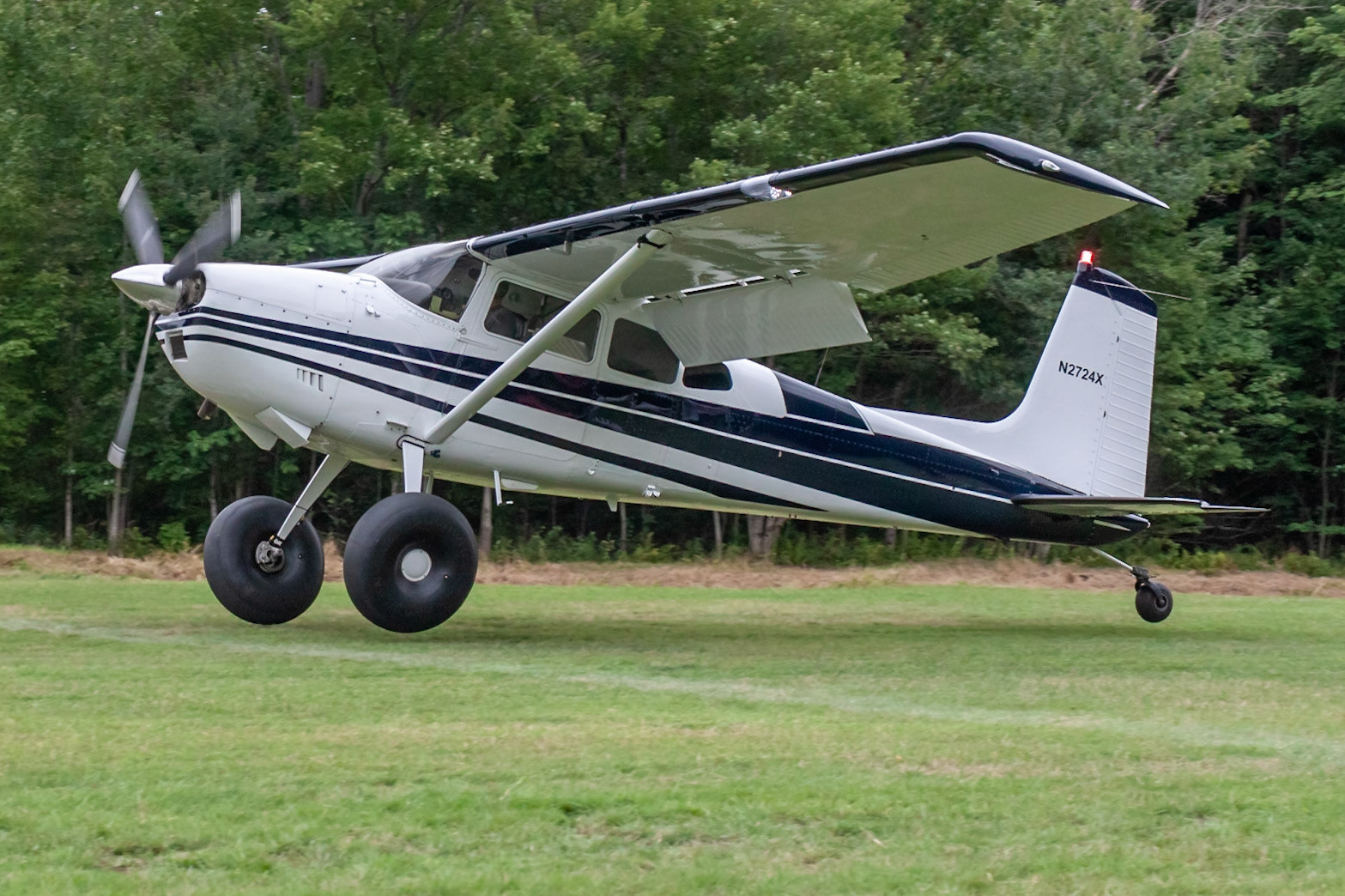Cessna 180 (N2724X, c/n 18051524) at the STOL competition during the 33rd annual Bowman Field (B10; Livermore Falls, ME) Fly-in on 2019-08-24.