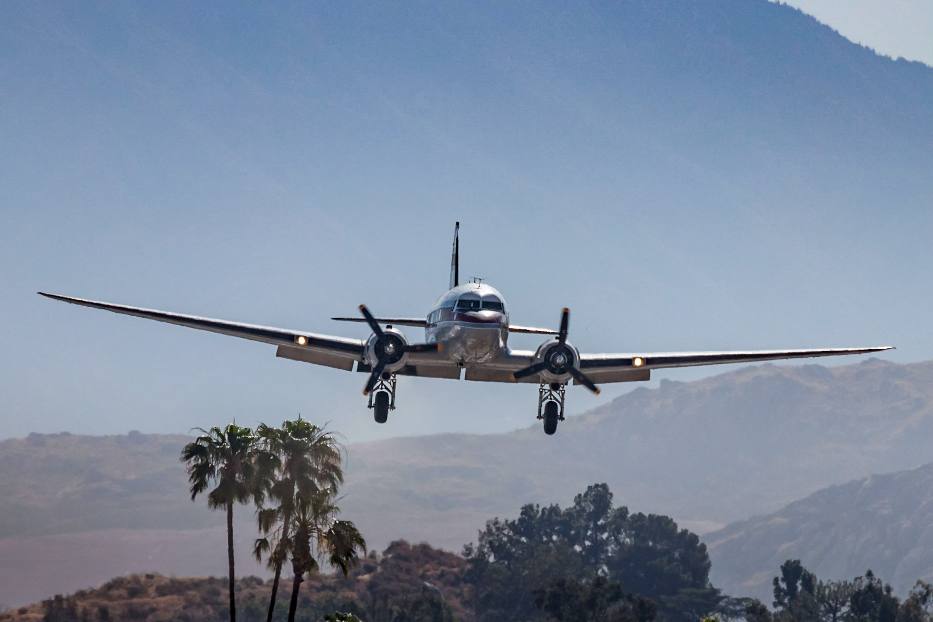Douglas C-47A (N103NA, c/n 9531, “Flabob Express”) lands during Flabob’s DC-3 Fly-in in Riverside, CA on 2017-05-20. This aircraft was originally delivered as 42-23669 and later served with the RAF 24 Sqn as FD879.