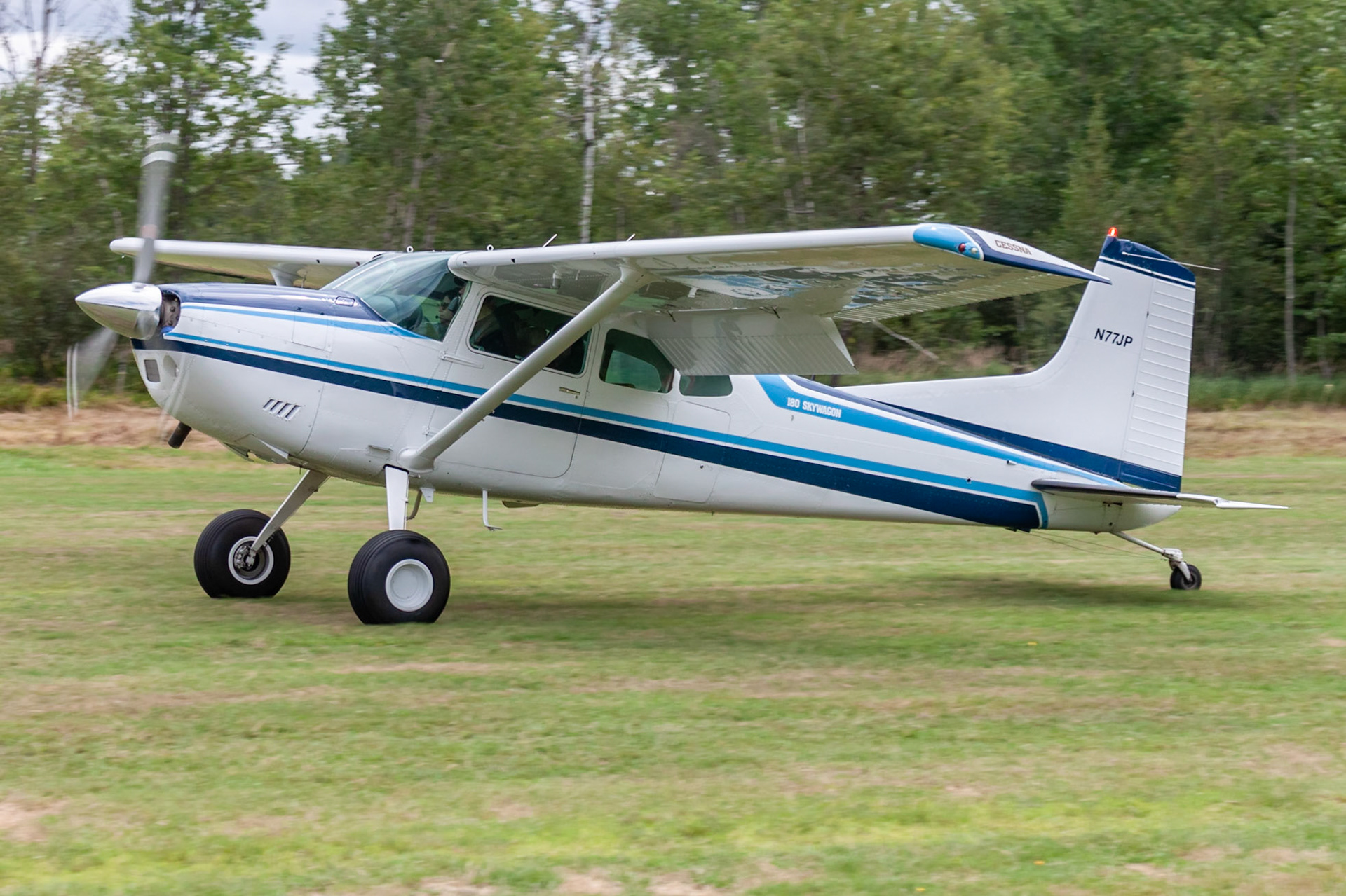 Cessna 180K (N77JP, c/n 18053123) at the 33rd annual Bowman Field (B10; Livermore Falls, ME) Fly-in on 2019-08-24.