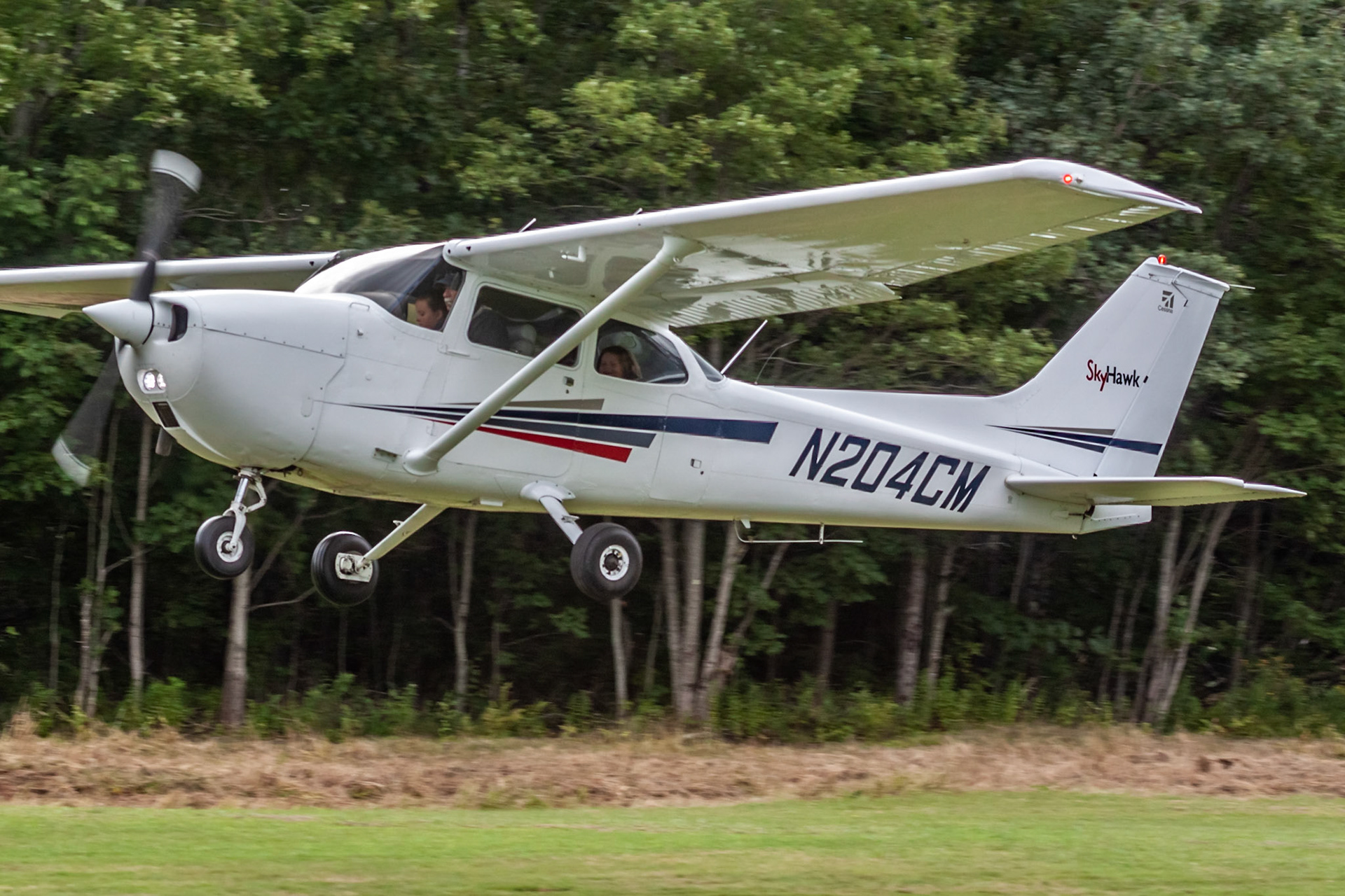 Cessna 172M (N204CM, c/n 17265224) at the 33rd annual Bowman Field (B10; Livermore Falls, ME) Fly-in on 2019-08-24.