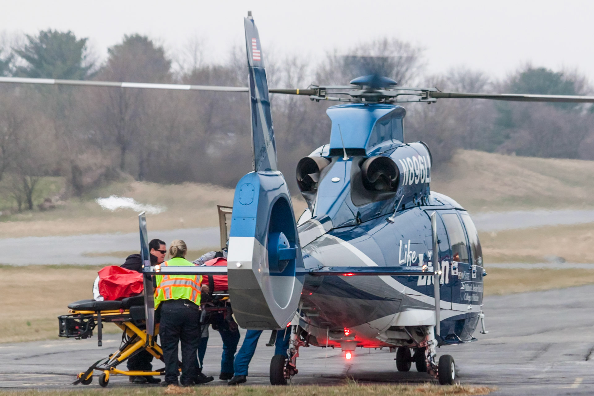 Eurocopter AS365 N3 Dauphin (N896LL, c/n 6294) operated by the Penn State Hershey Life Lion Critical Care Transport. A crash between a tractor trailer and a car closed I-81S on 2017-03-26 near Carlisle, PA. Here one of the victims is being loaded from an ambulance at the Carlisle Airport (N94).
