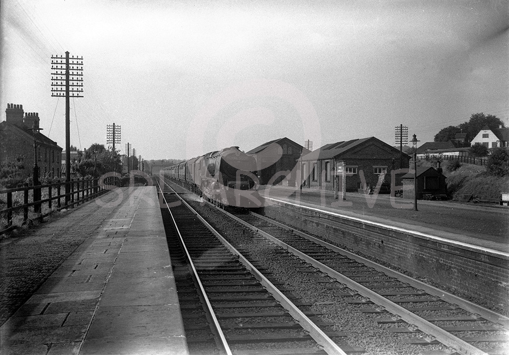 Stanier LMS Coronation Class 4-6-2 No ?? going well through Kings Langley station with the up 'Royal Scot' late 1950's SRL No 225 