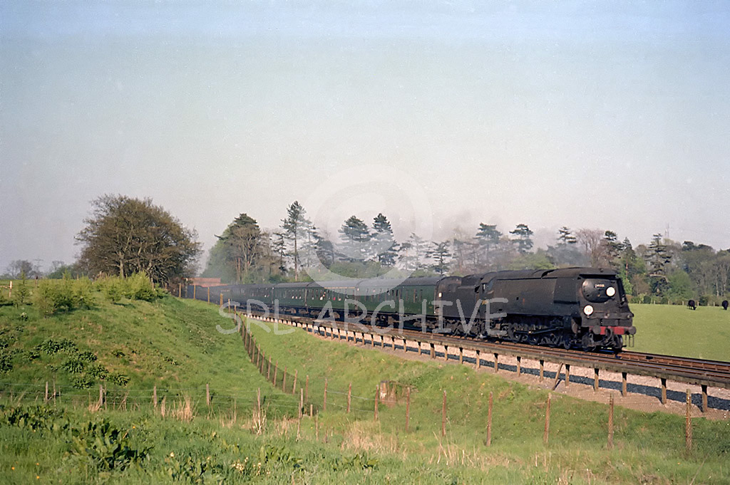 34019 'Bideford' on a Waterloo-Bournemouth express in 1966 at Haslemere a diverted service due to electrification work SRL No 956 